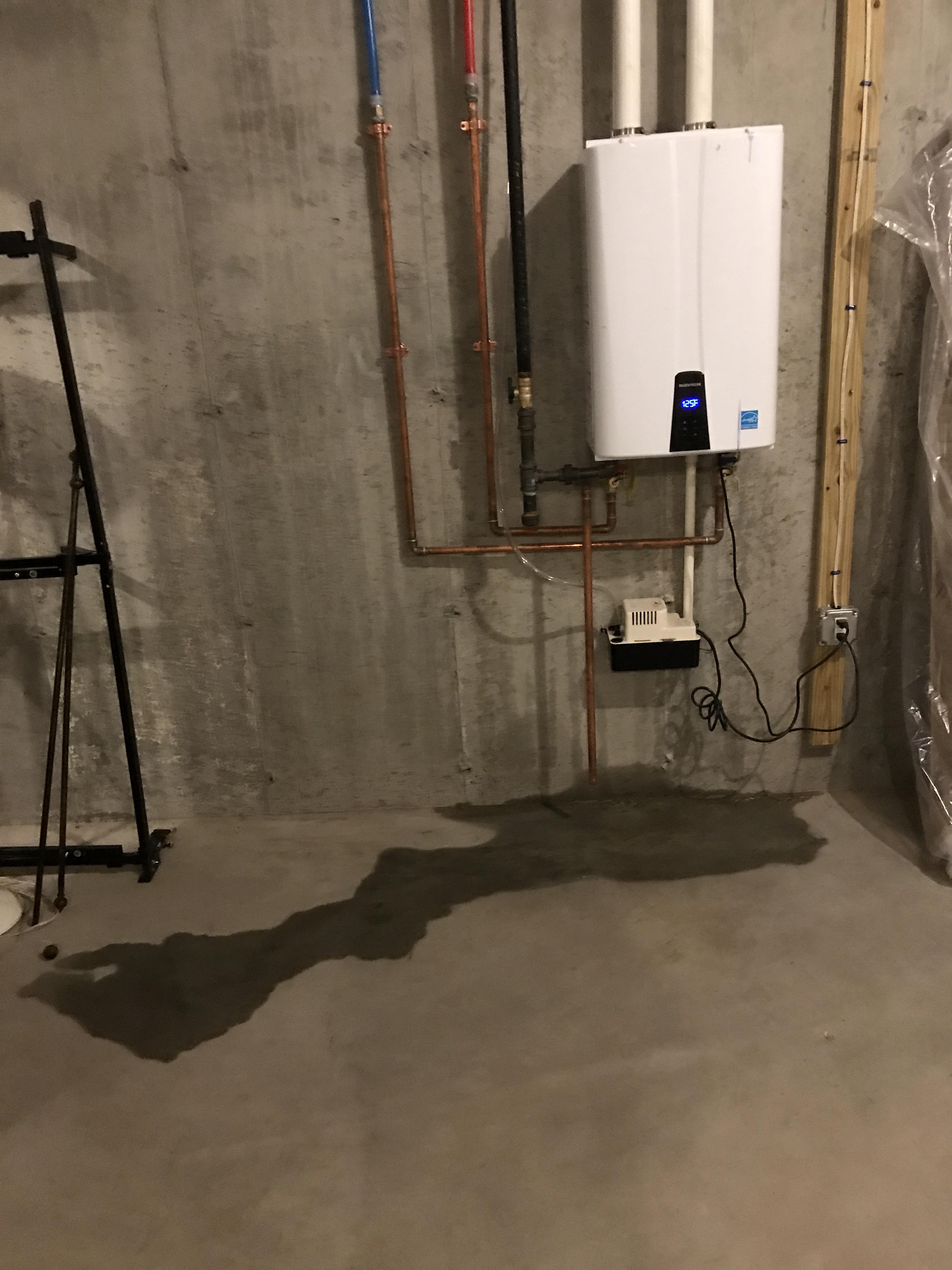 Water dripping from tankless water heater. Brand new can someone