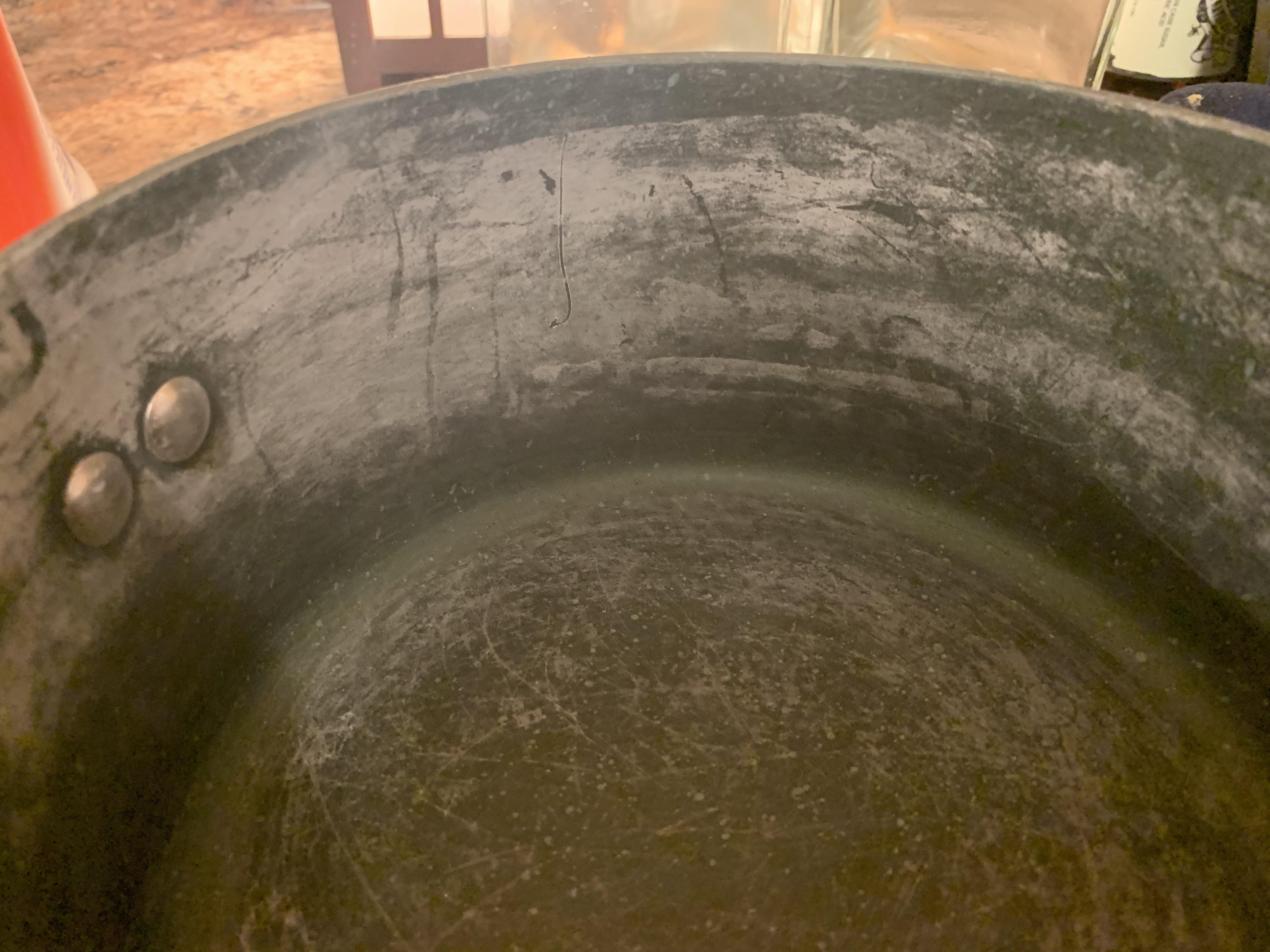 Brand new LG dishwasher leaving white film on pots. 13yo kitchen aid that was here before did