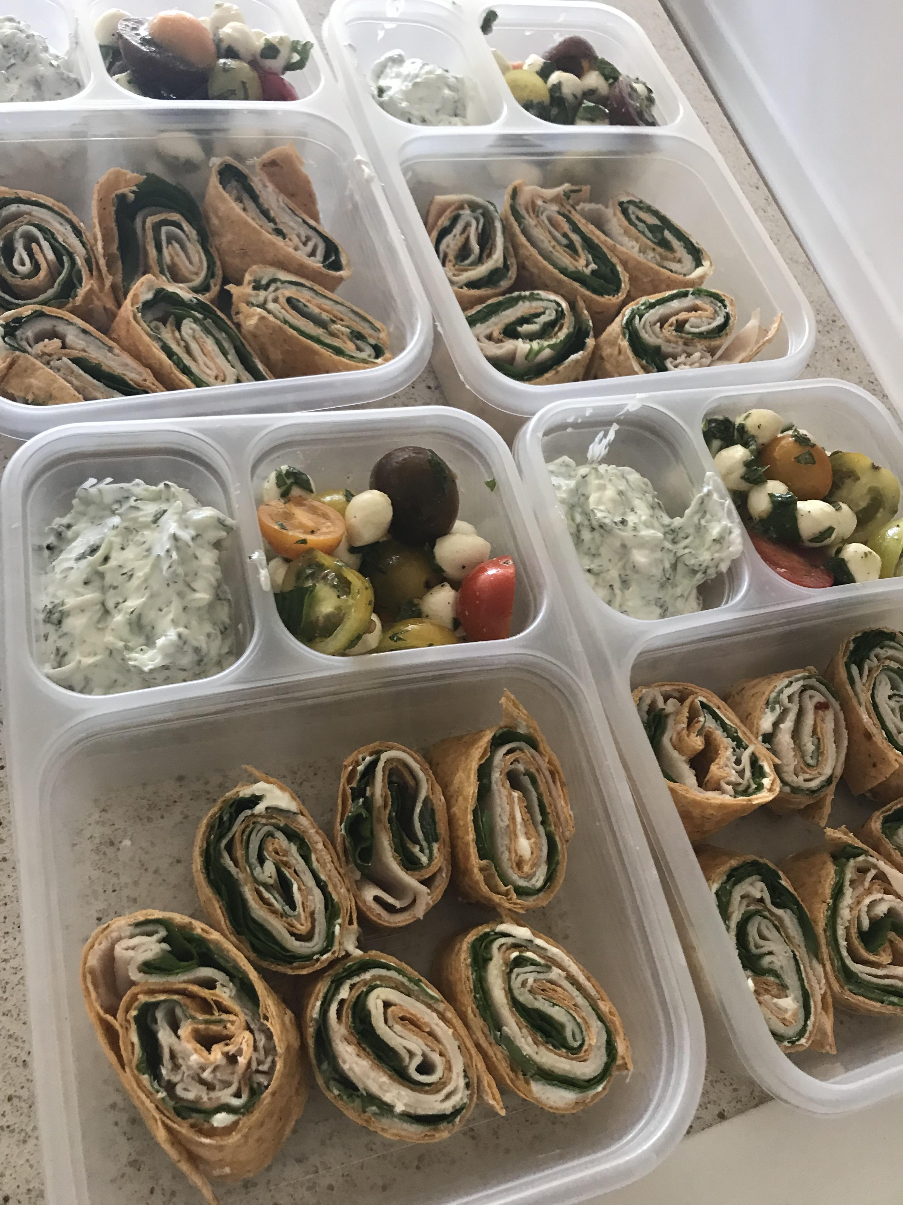 Sundried tomato wrap with herbed yogurt dip paired with mozzarella and tomato salad r