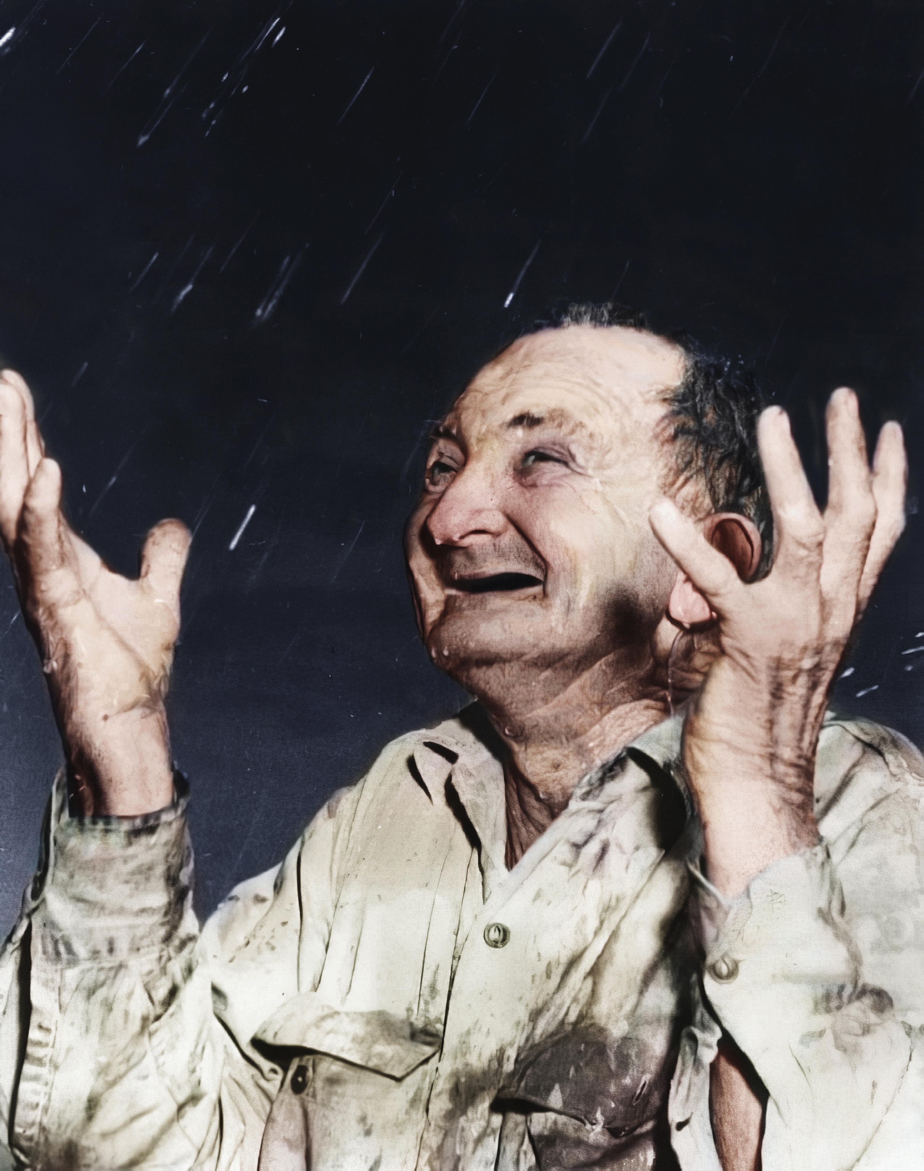 San Antonio farmer Sam Smith celebrates the rain on Easter, March 24, 1951, after a severe