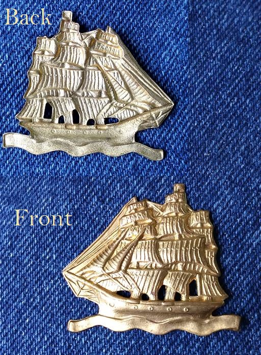 Brass? About silver dollar size, no marks or fasteners r/Whatisthis