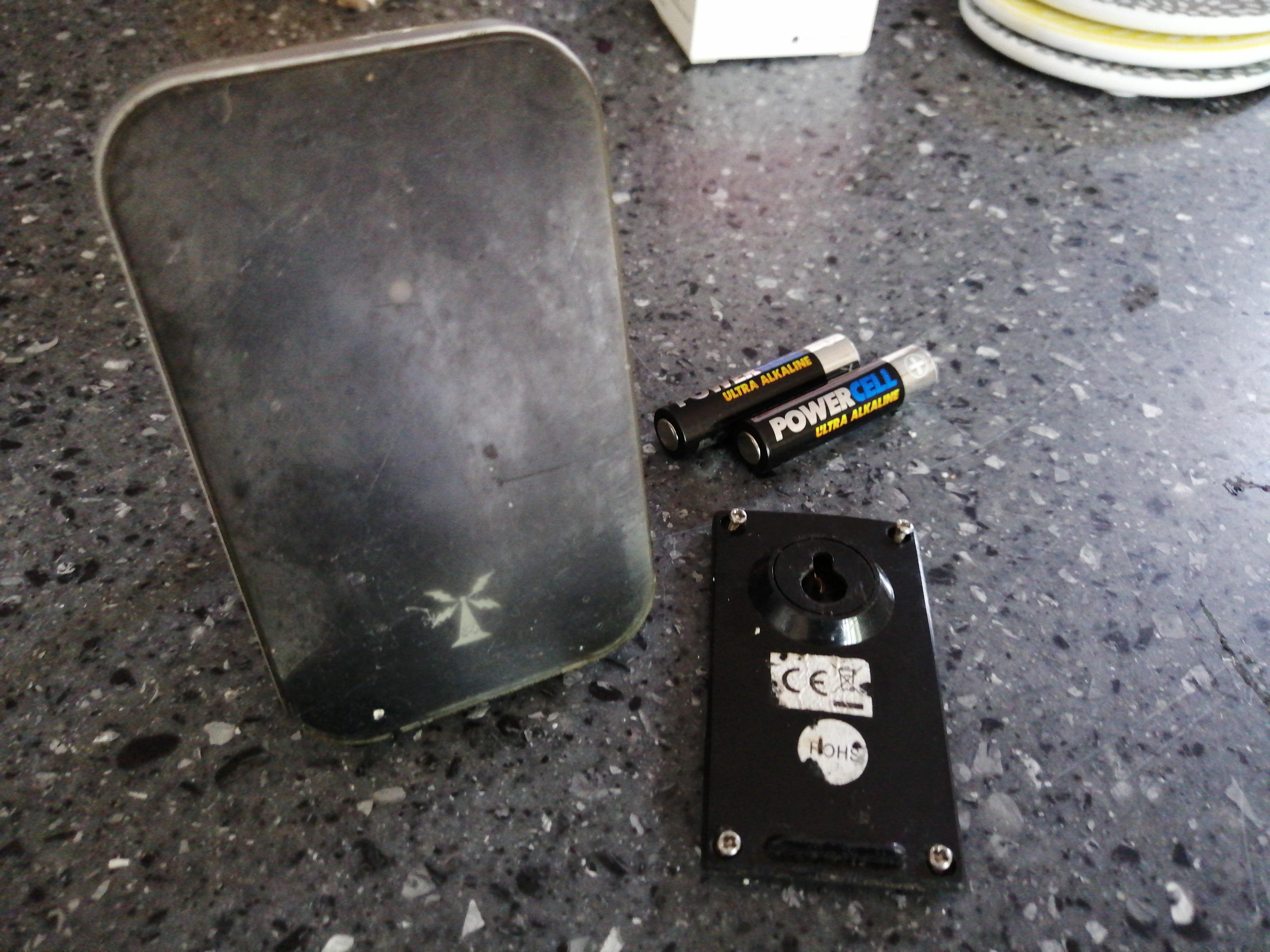 2 AAA batteries, foldable propup, blinking red LED. Found loose in our