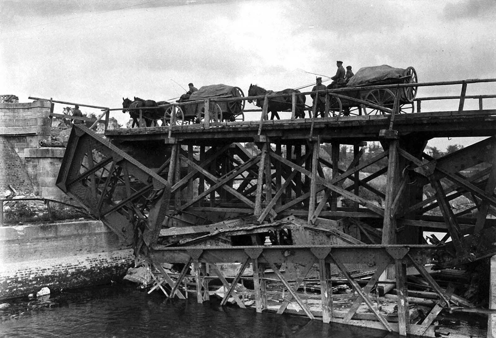 A temporary wooden bridge built on the wreckage of the collapsed