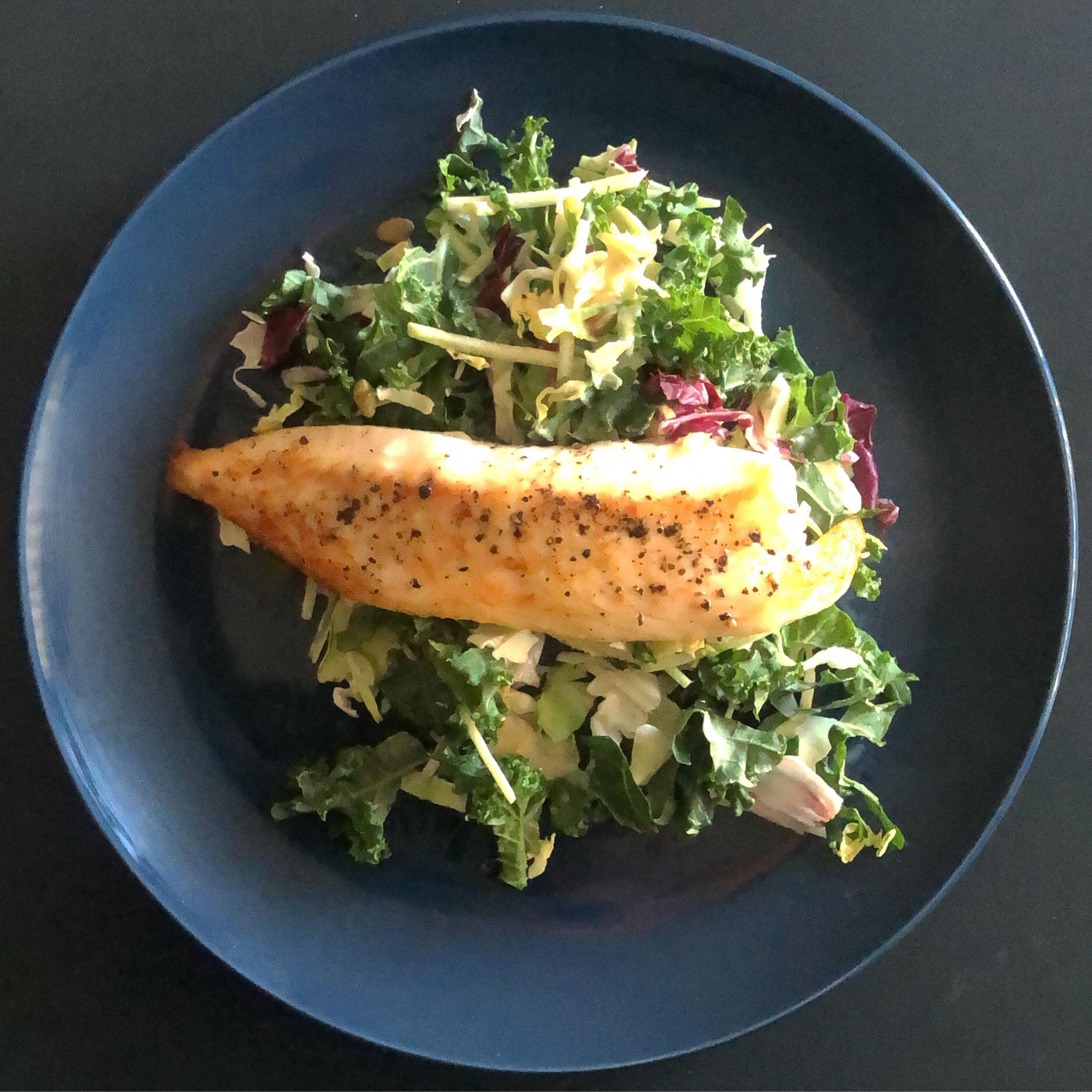 Pan fried Tilapia on a bed of Sweet Kale salad. This healthy lunch took