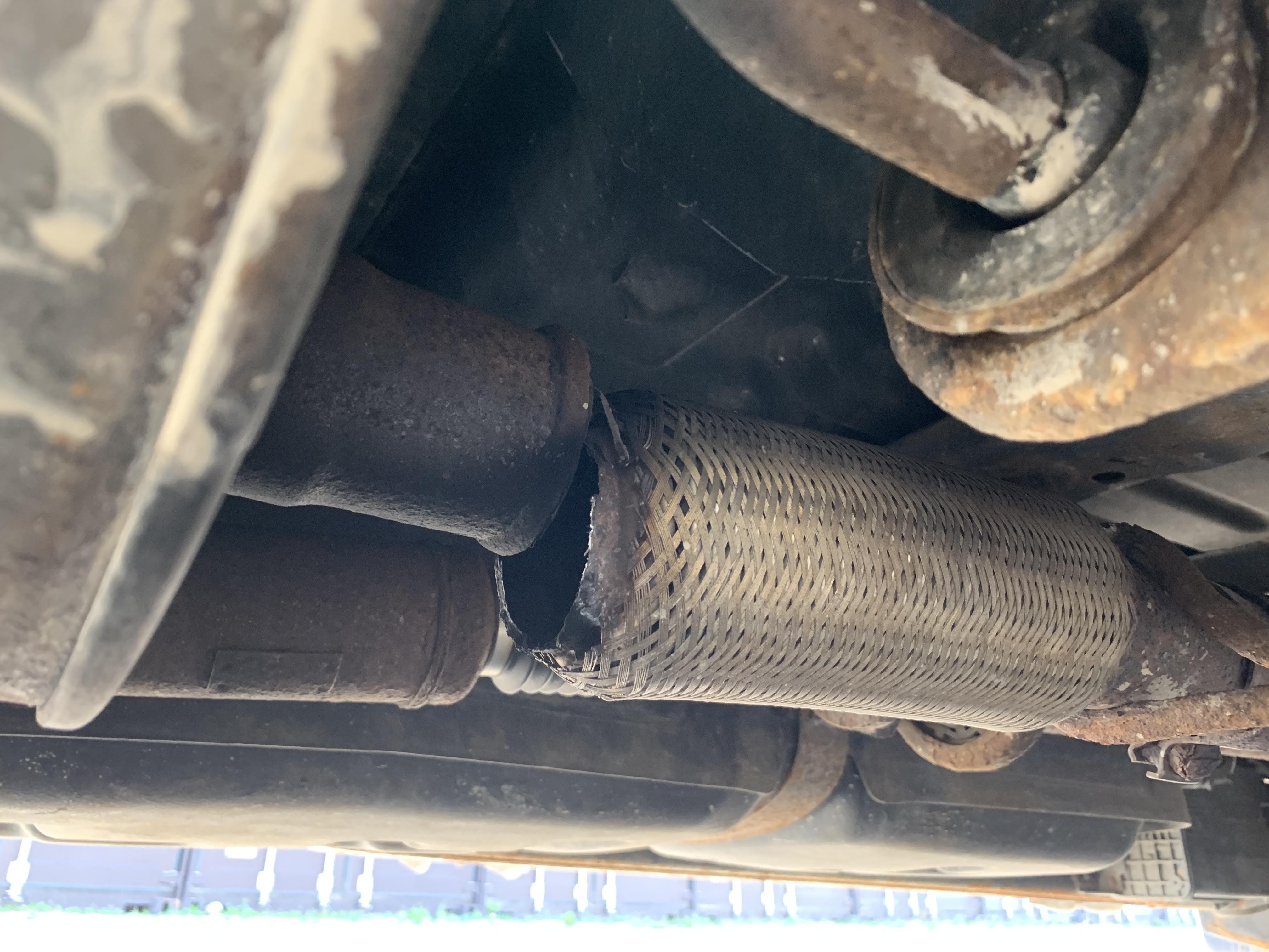 Severed exhaust pipe under car. Noticed when I heard rattling as that’s