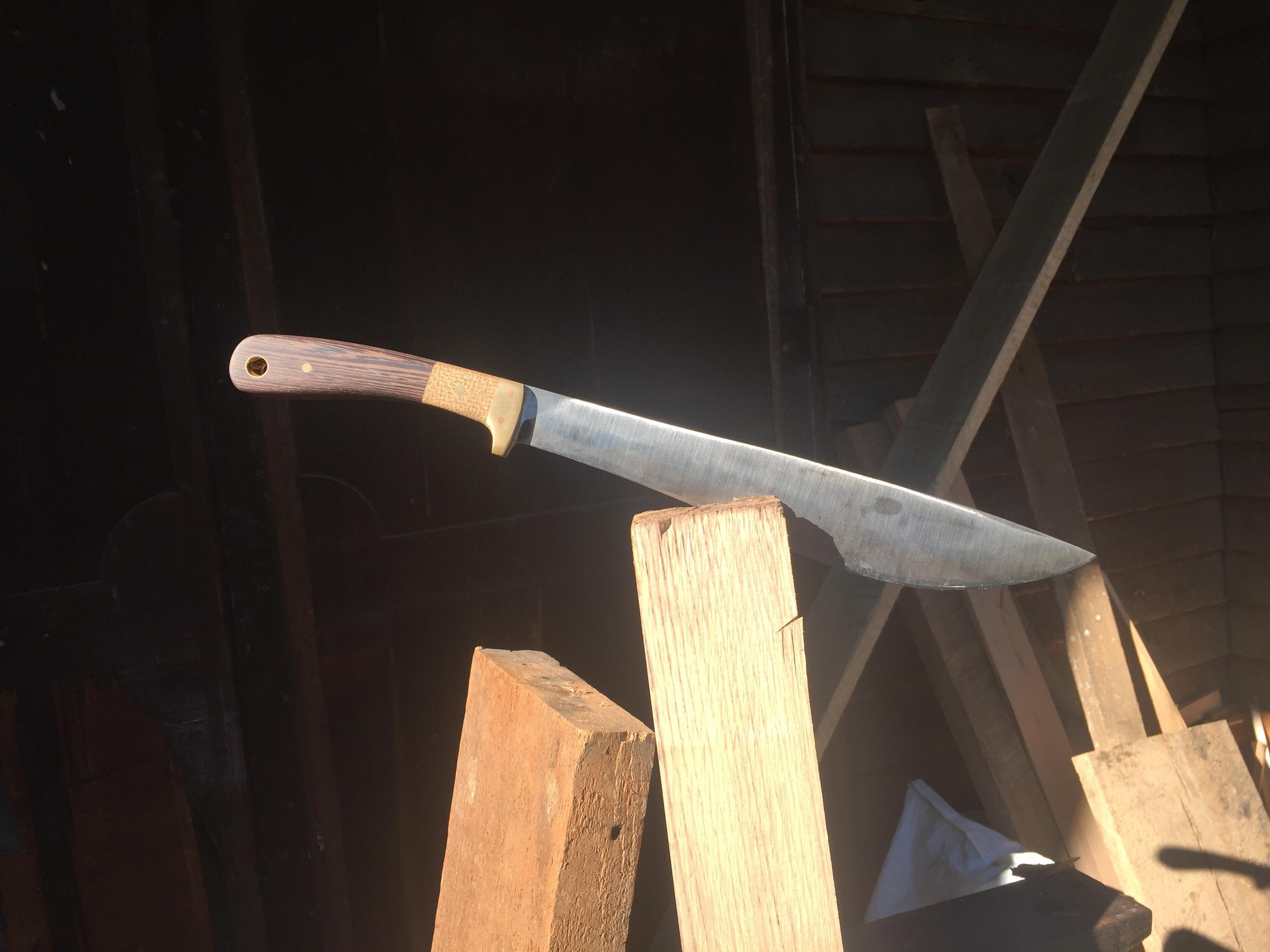 My first blade! A Bolo knife out of 1084 with a Wenge and Burlap Micarta handle and brass