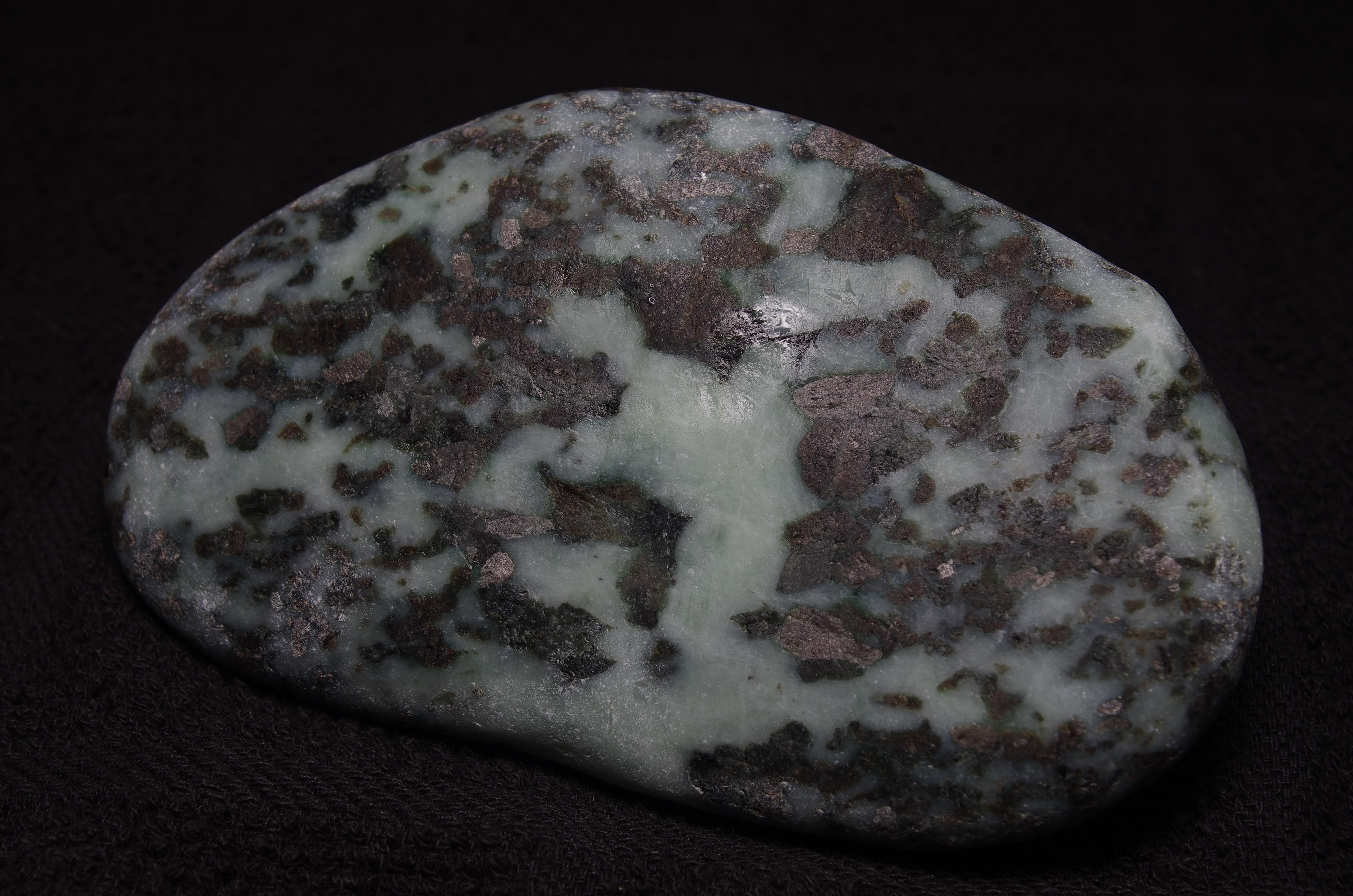 Rock with silver, metallic looking inclusions throughout, found in
