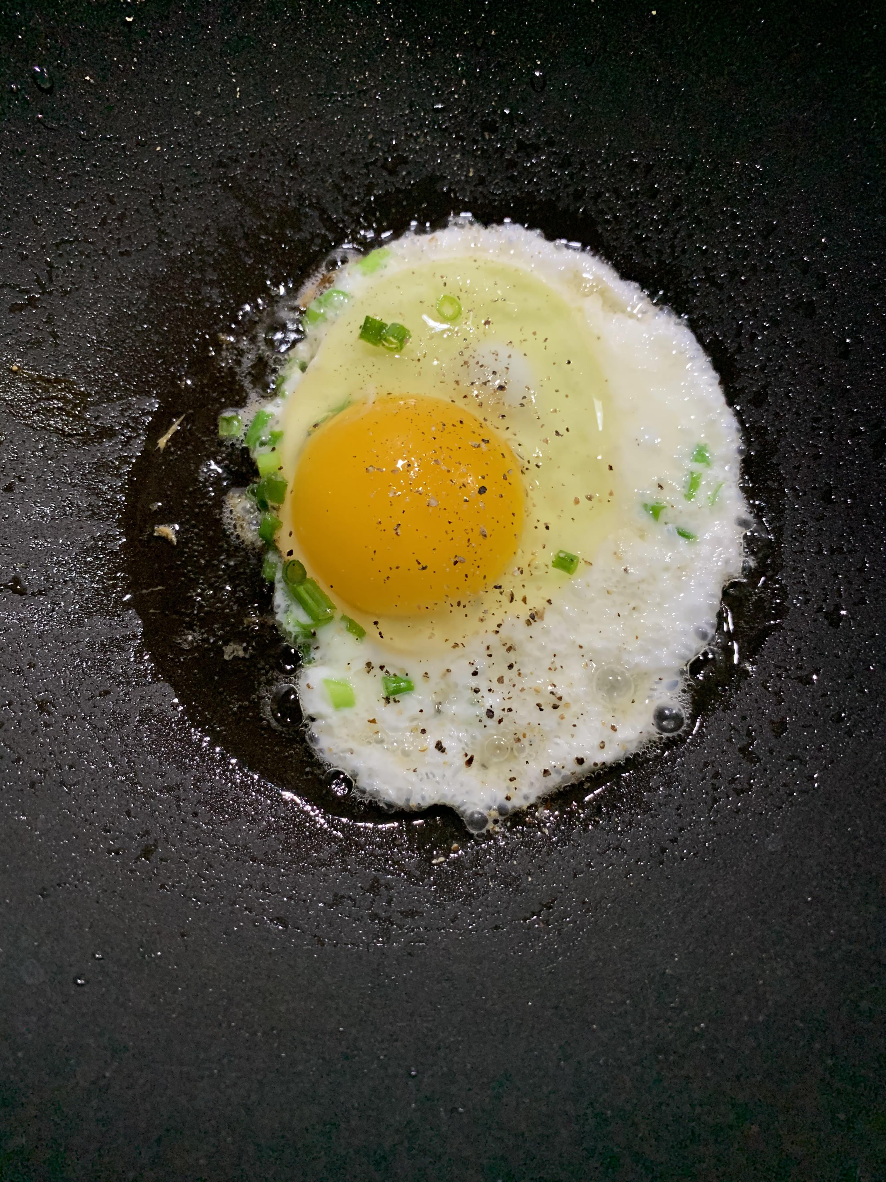 Olive oil fried egg a very simple quick snack or part of a meal. 1 egg
