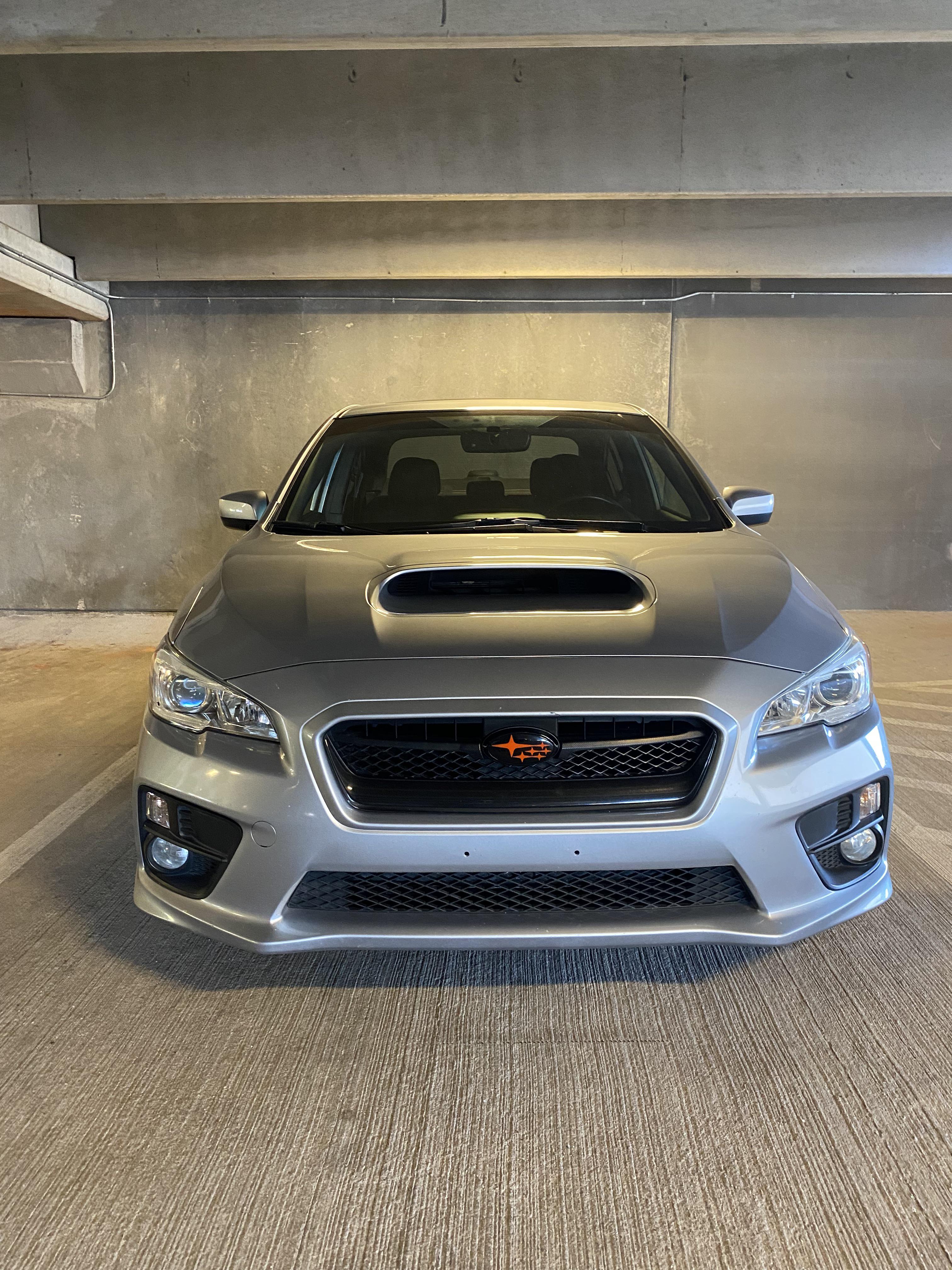Finally got my new emblems on my WRX! Love the black and orange with