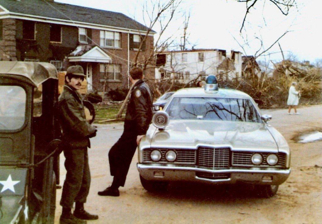 A Jefferson County Police Car and an Army Jeep in Louisville, Kentucky