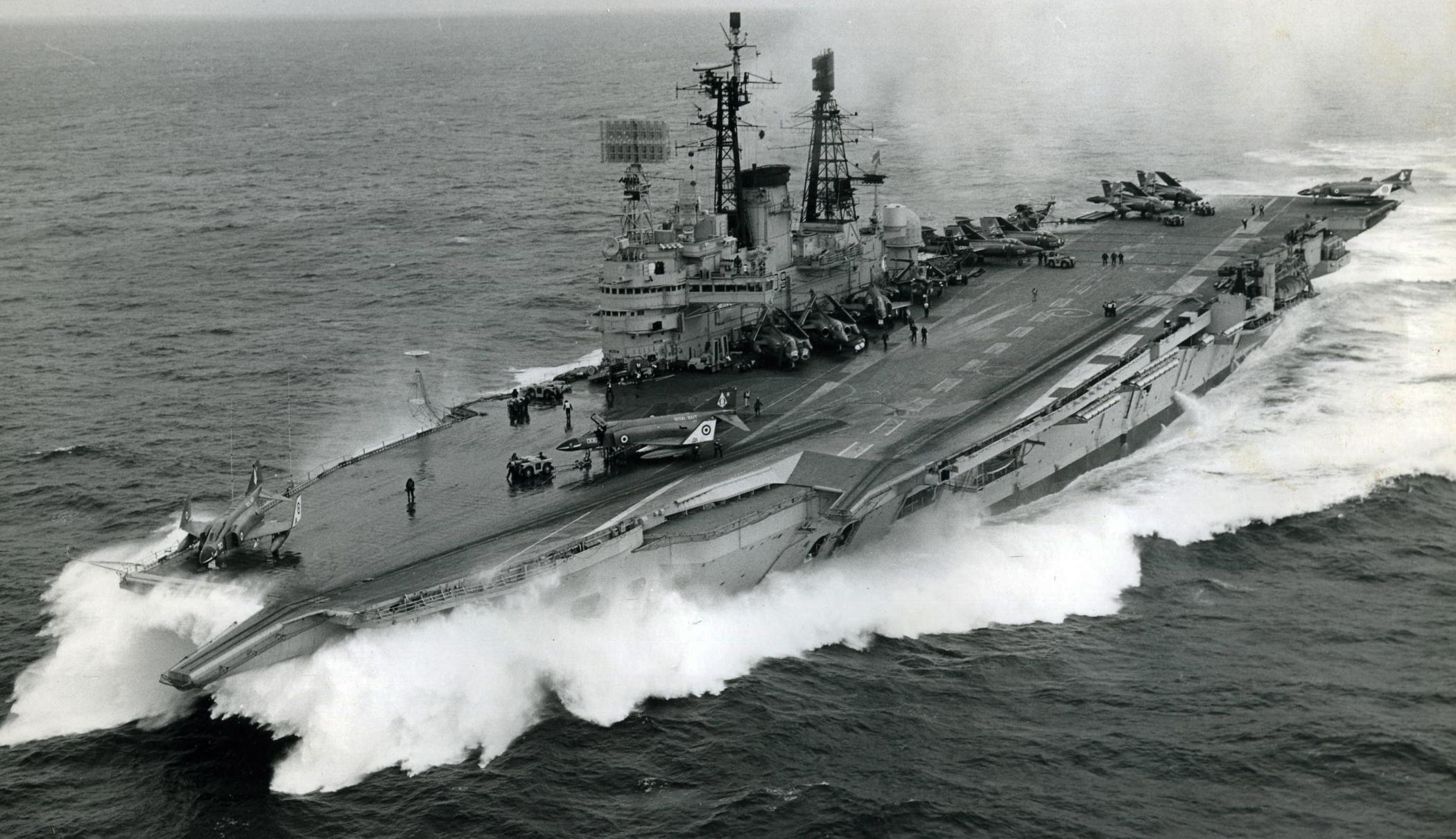 Audaciousclass aircraft carrier HMS Ark Royal R09 taking on the waves