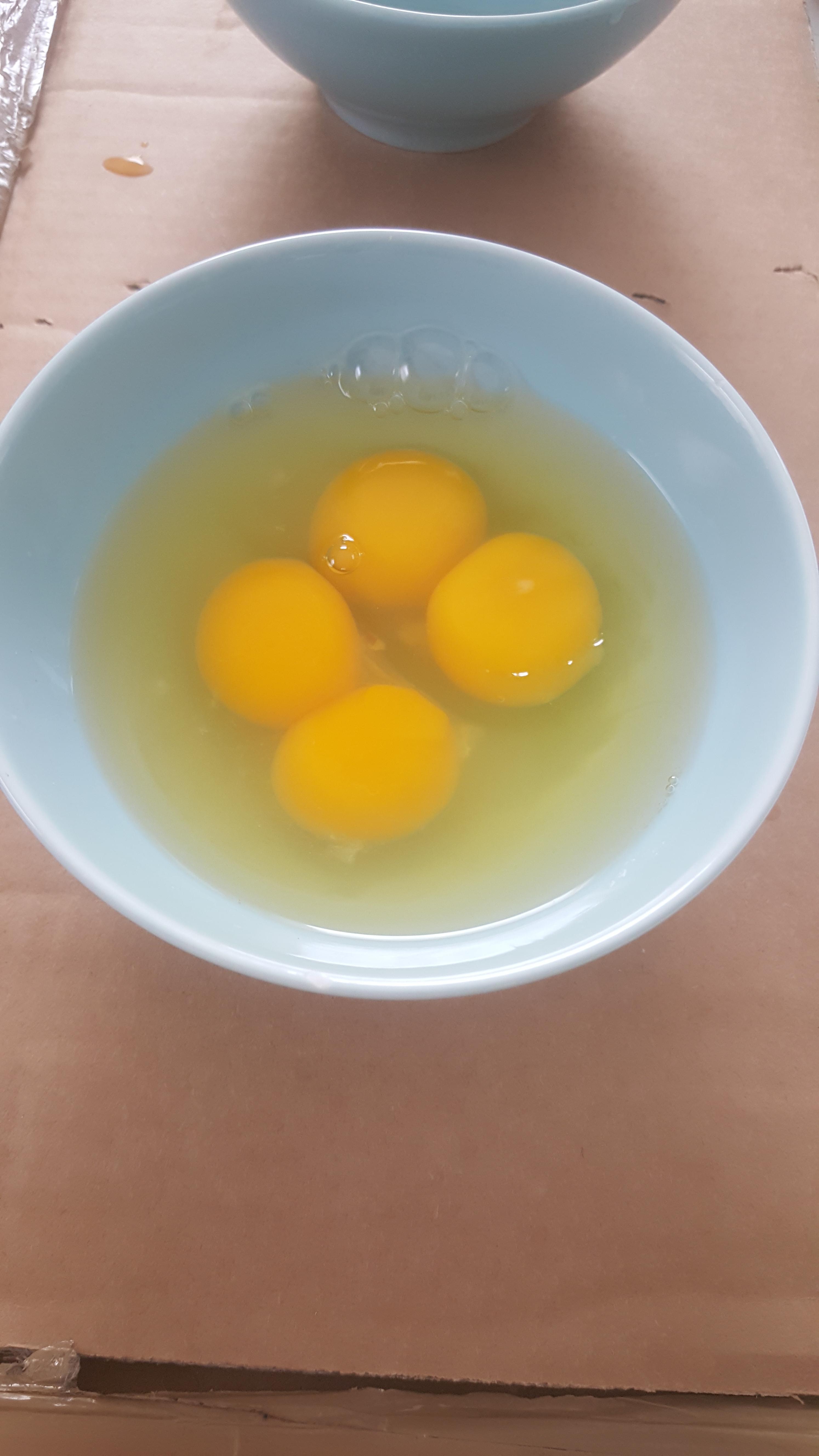 Two double egg yolked eggs. Double luck for me! r/WeirdEggs