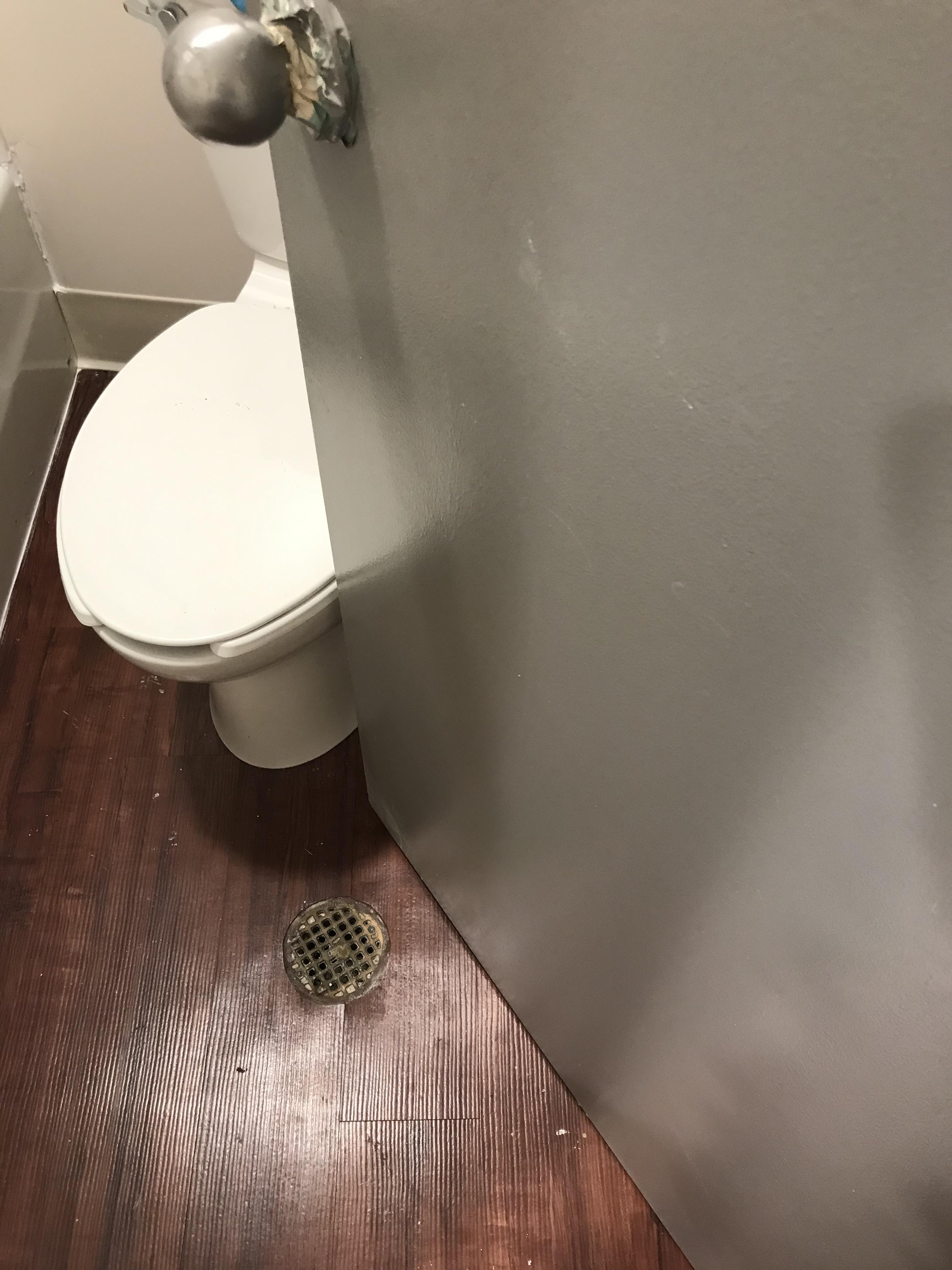 The toilet in our new apartment is crooked to let the door open r