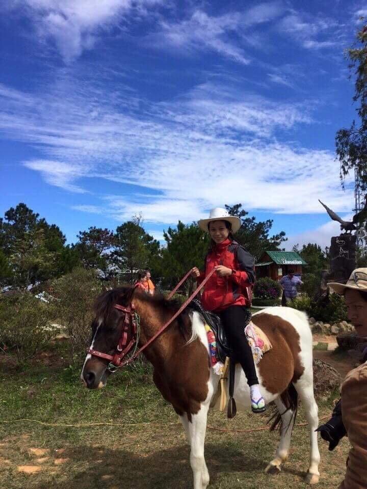 My cousin and her sock, sandal combo horse riding in Vietnam ☺️ I love