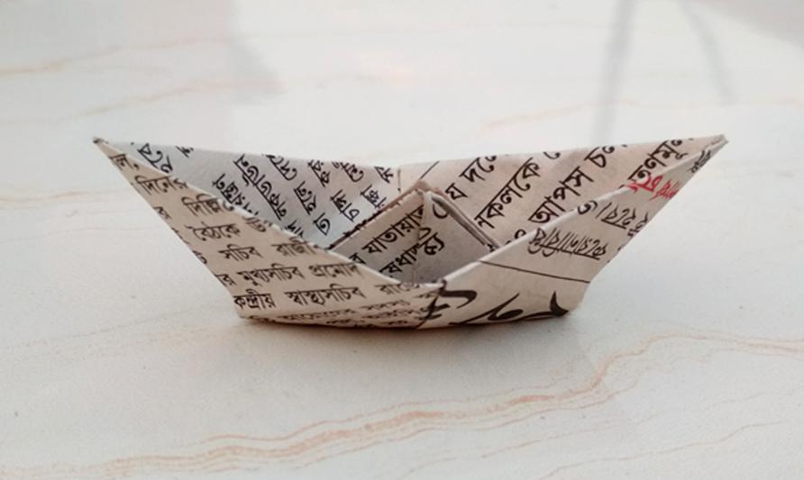 I made this origami boat using newspaper. Best reuse idea. Get video