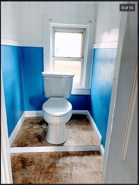 This bathroom. The toilet is in the center of the room, not touching