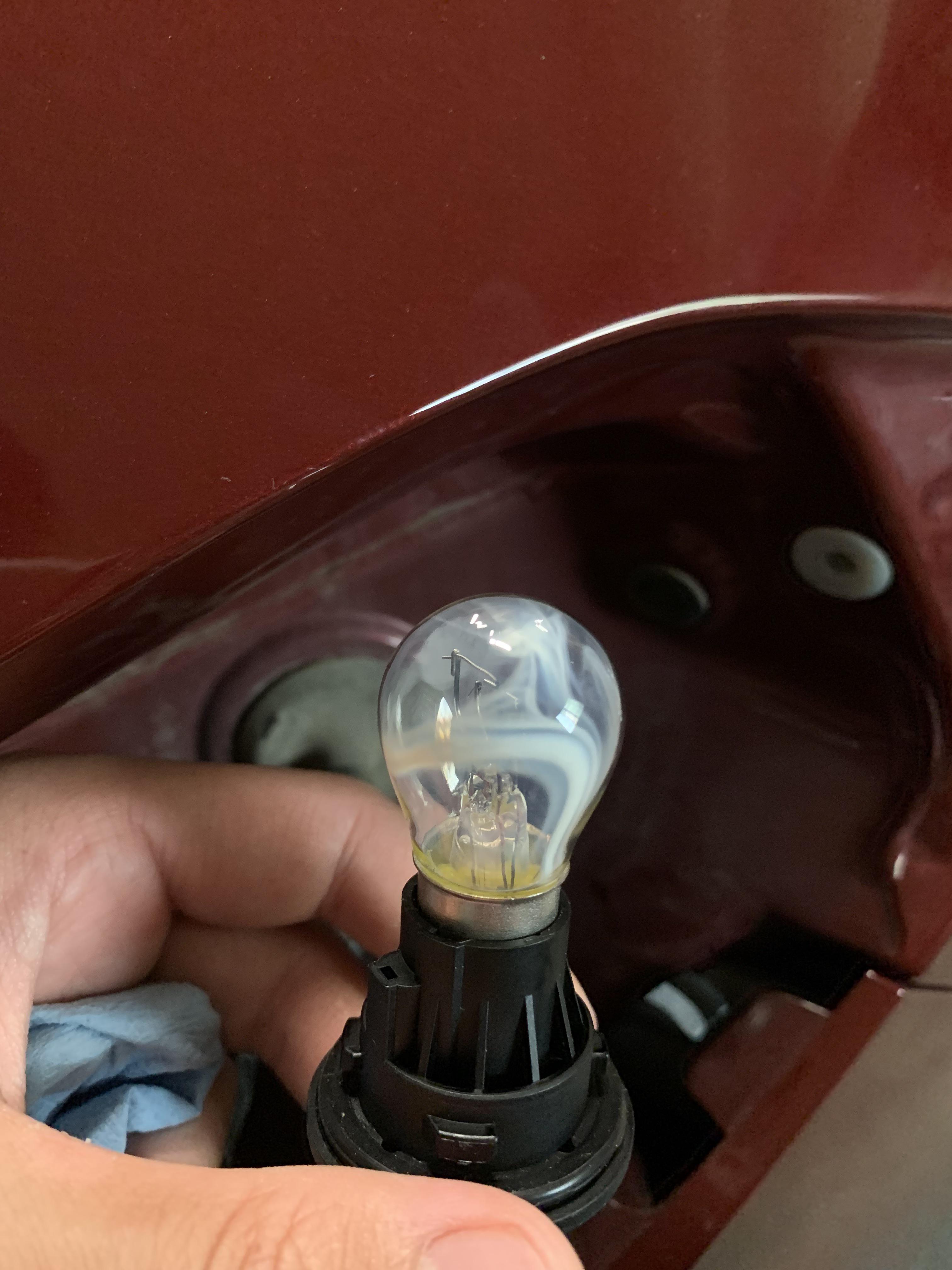 I installed a new brake light. The bulb turn white? Why? It still works
