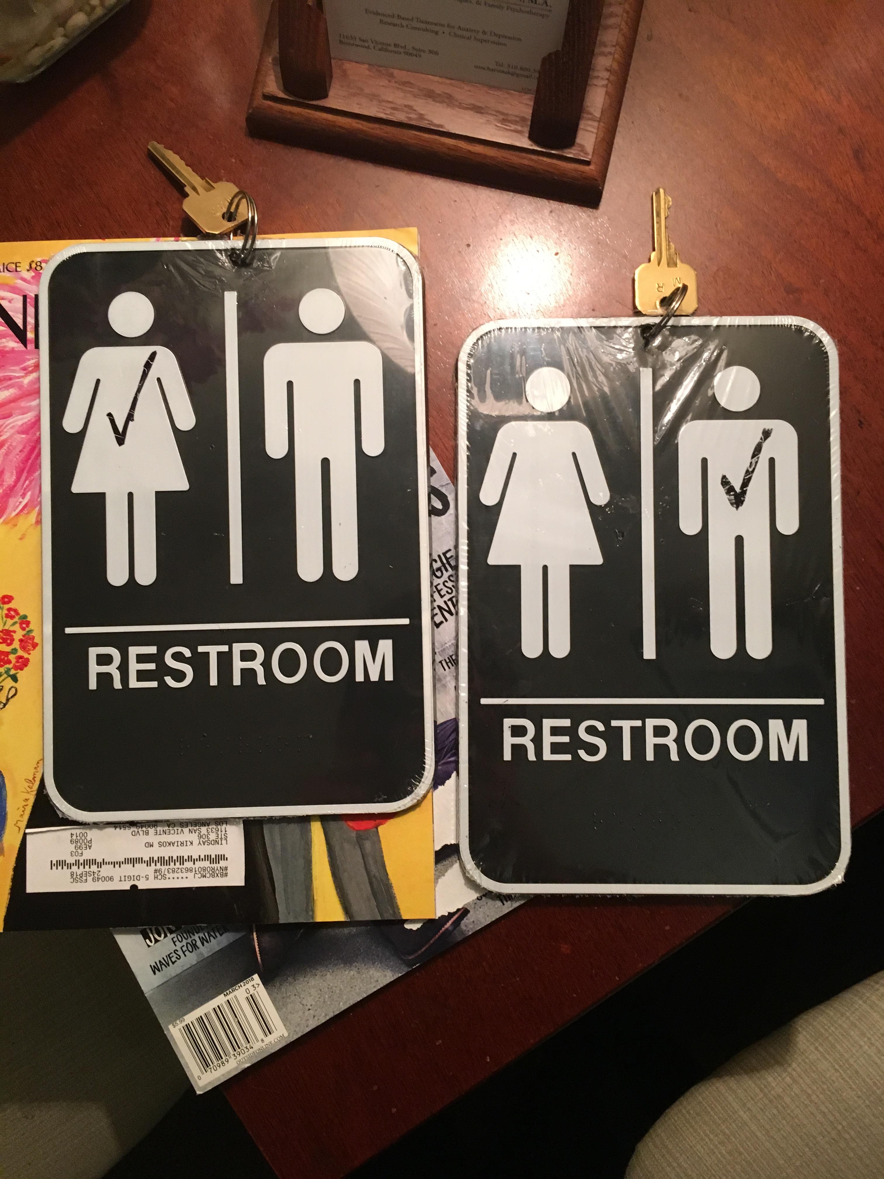 These bathroom keys in an office building are attached to full hangable