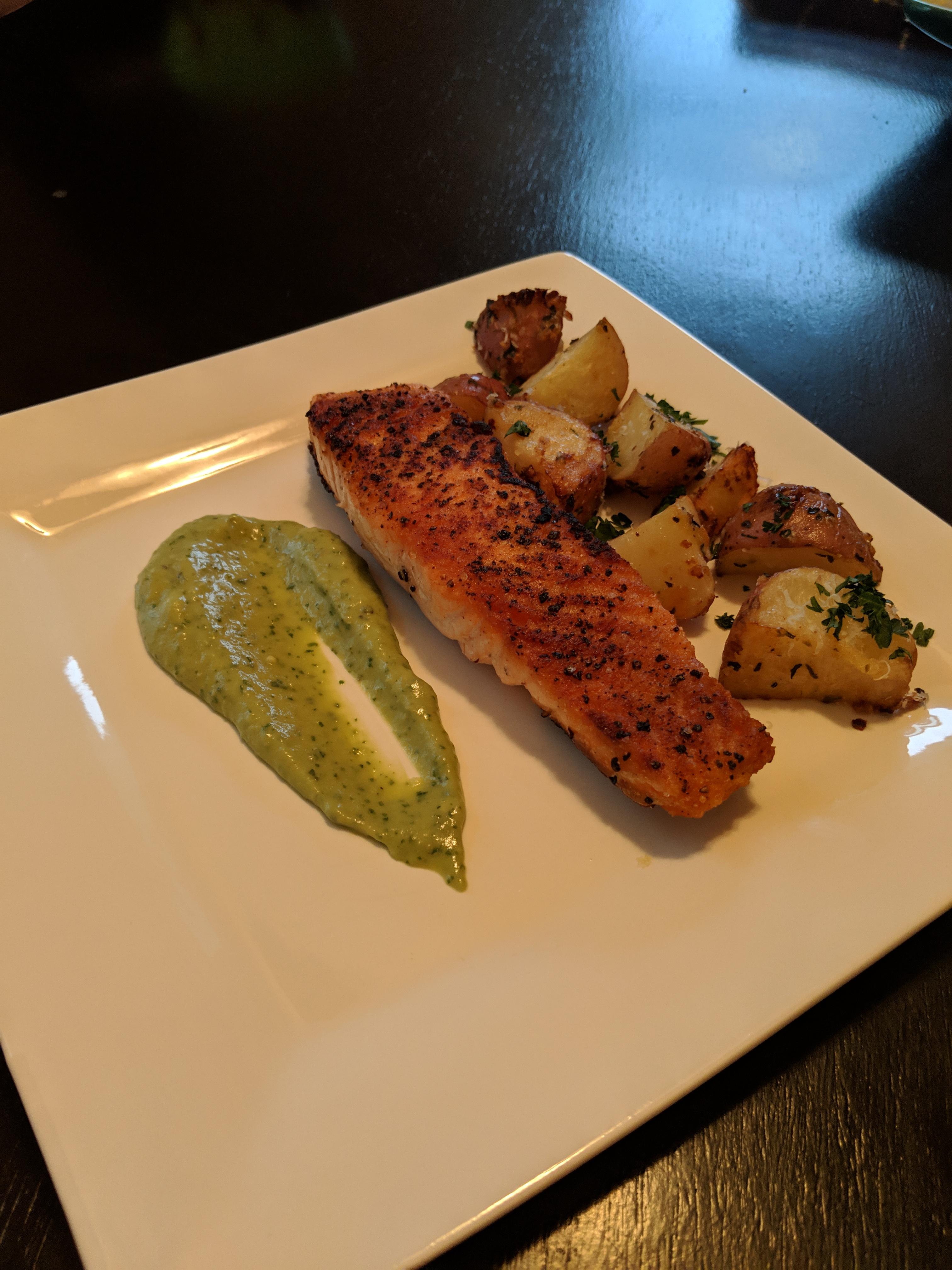 Pan seared salmon with oven roasted garlic potatoes, and a avocado