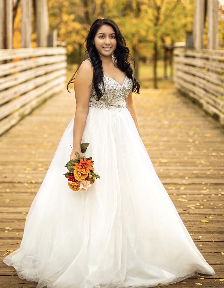 My wedding dress is actually a prom dress. Got it for 1/3 the price of