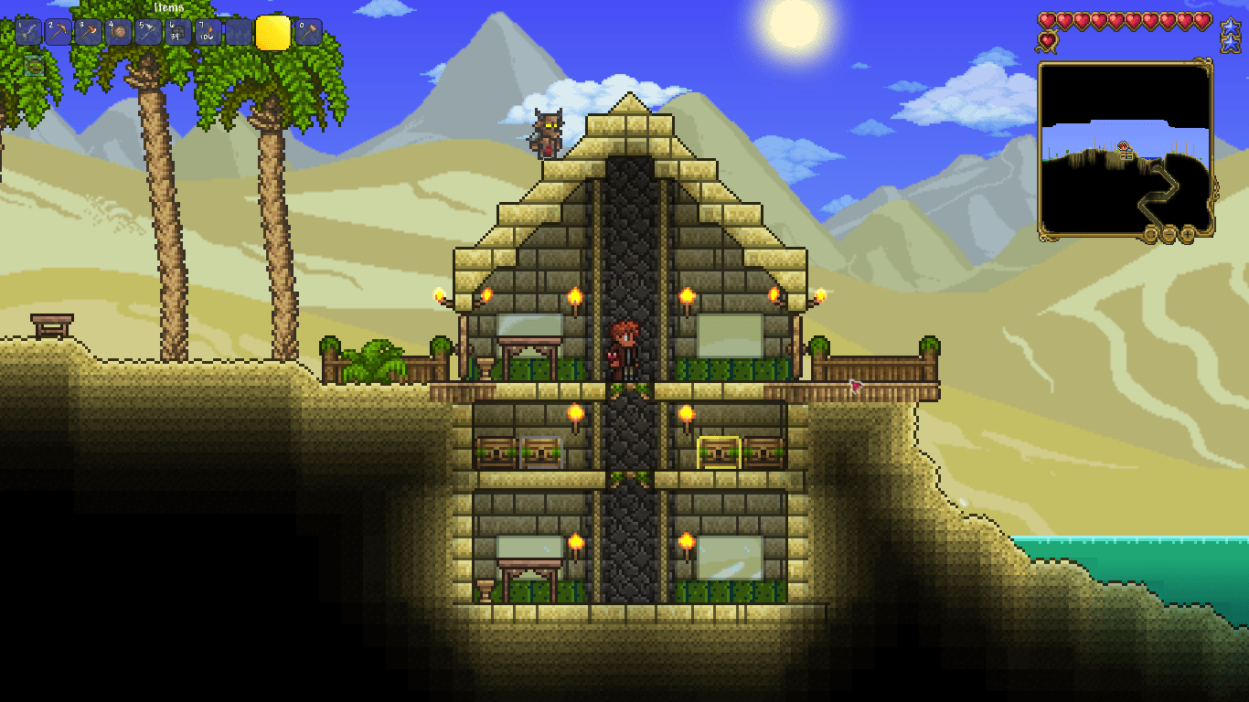 A pyramid themed house, done with copper tools Terraria