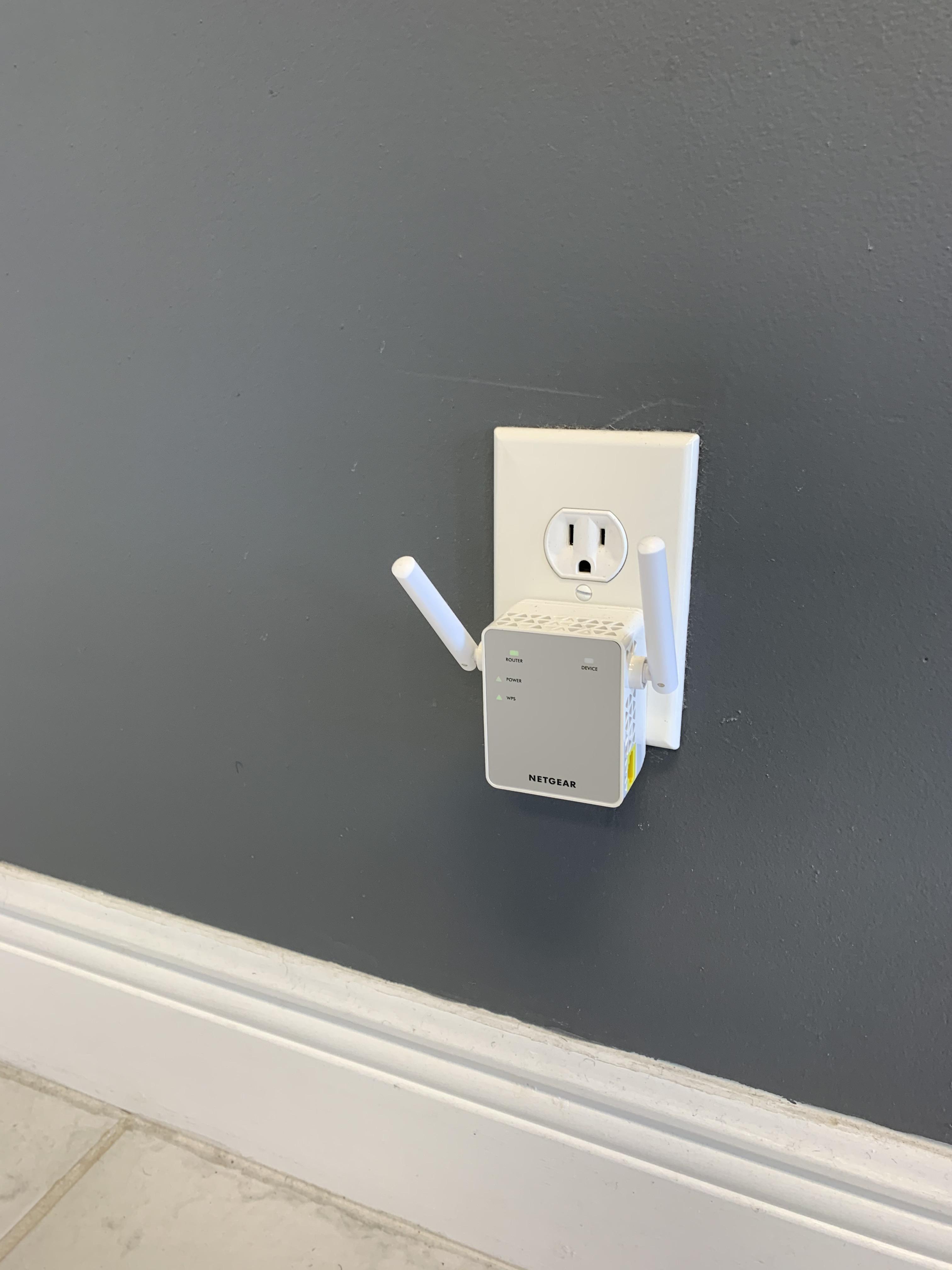This WiFi extender makes this outlet look like he is in a panic. r