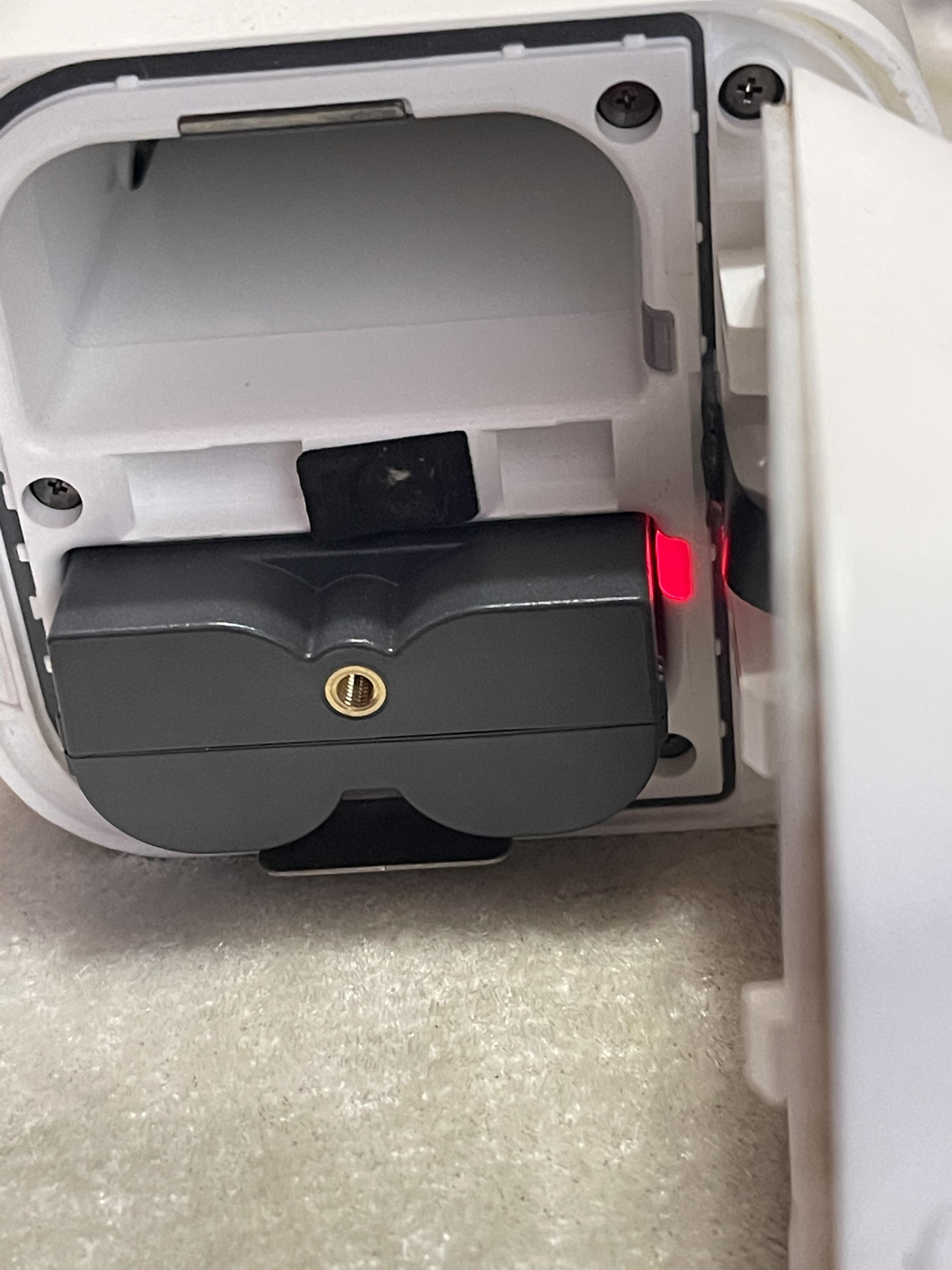 Ring Spotlight Cam red light in battery compartment. Battery is fully