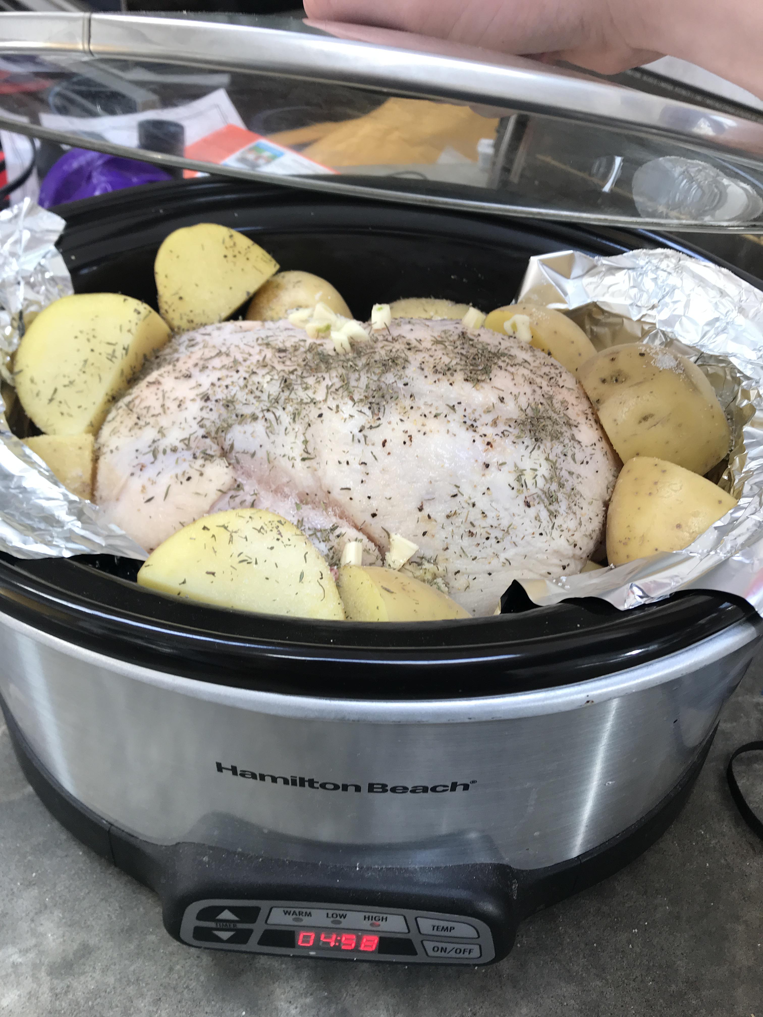 Slow cooker whole chicken with potatoes coming up in five hours! r