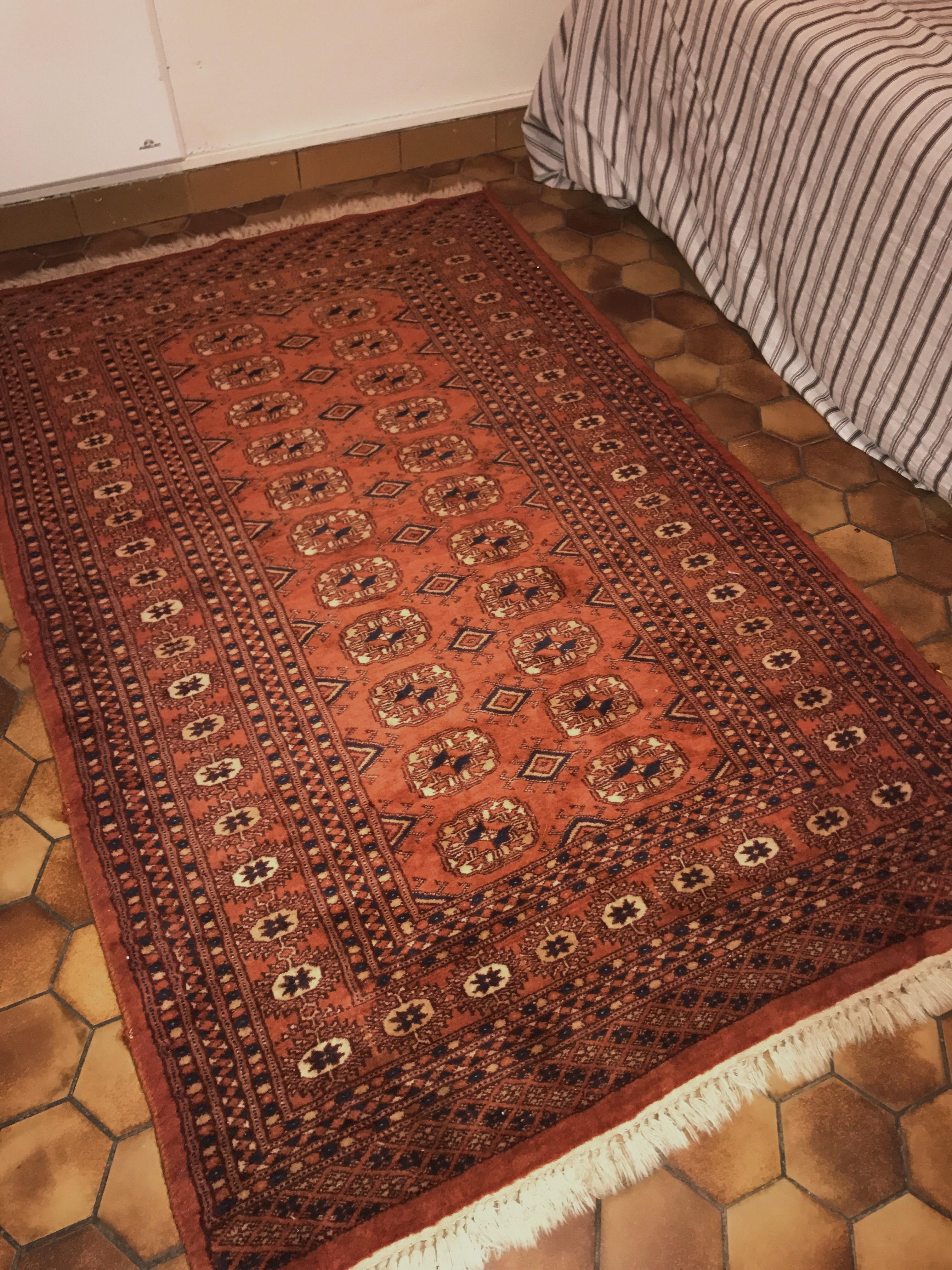 Burnt orange and navy silkwool blend Persian rug, €55. r