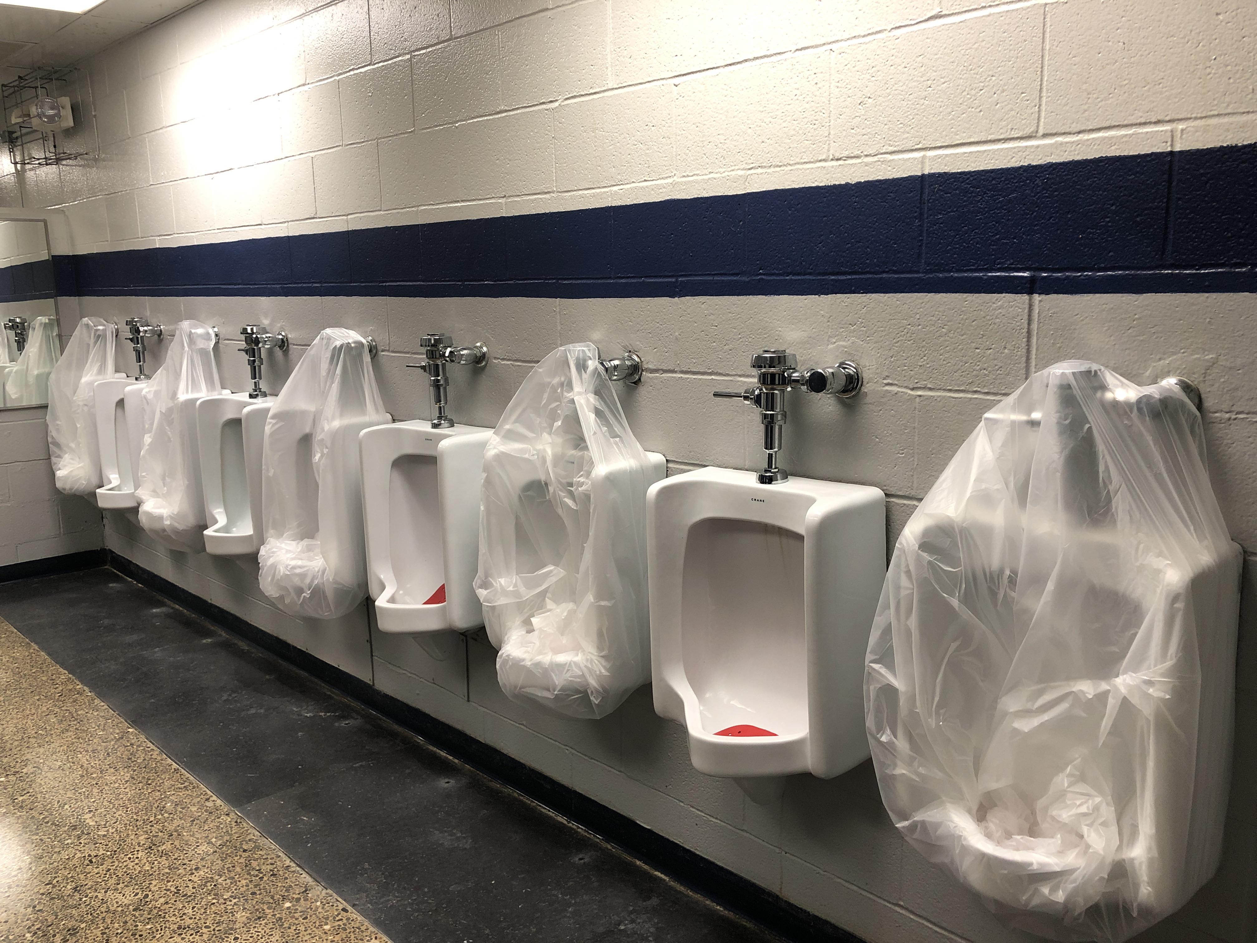 My school could have covered the urinals more efficiently by uncovering