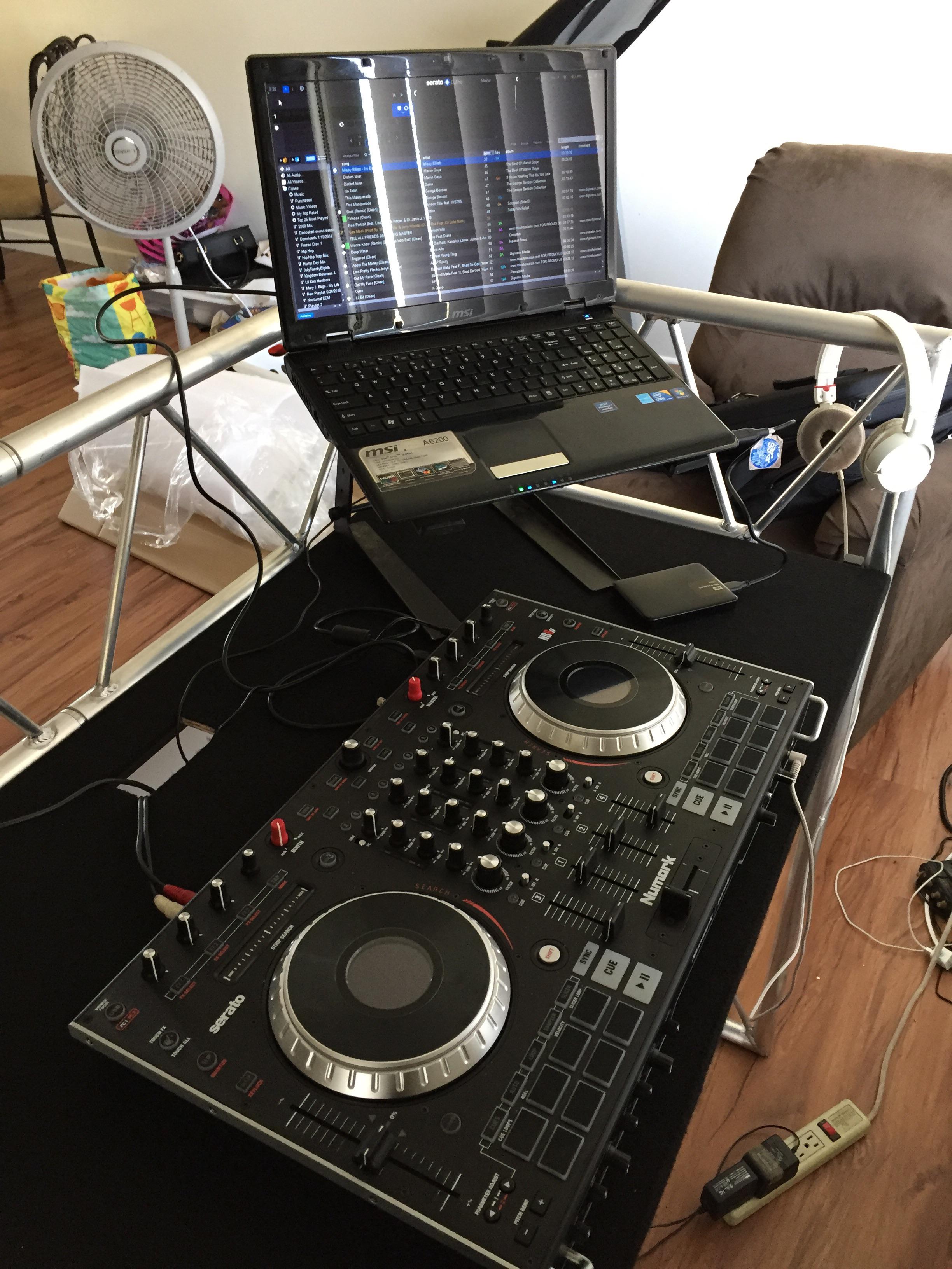Numark NS6II, MSI laptop running Serato Dj Pro, sitting on top of my