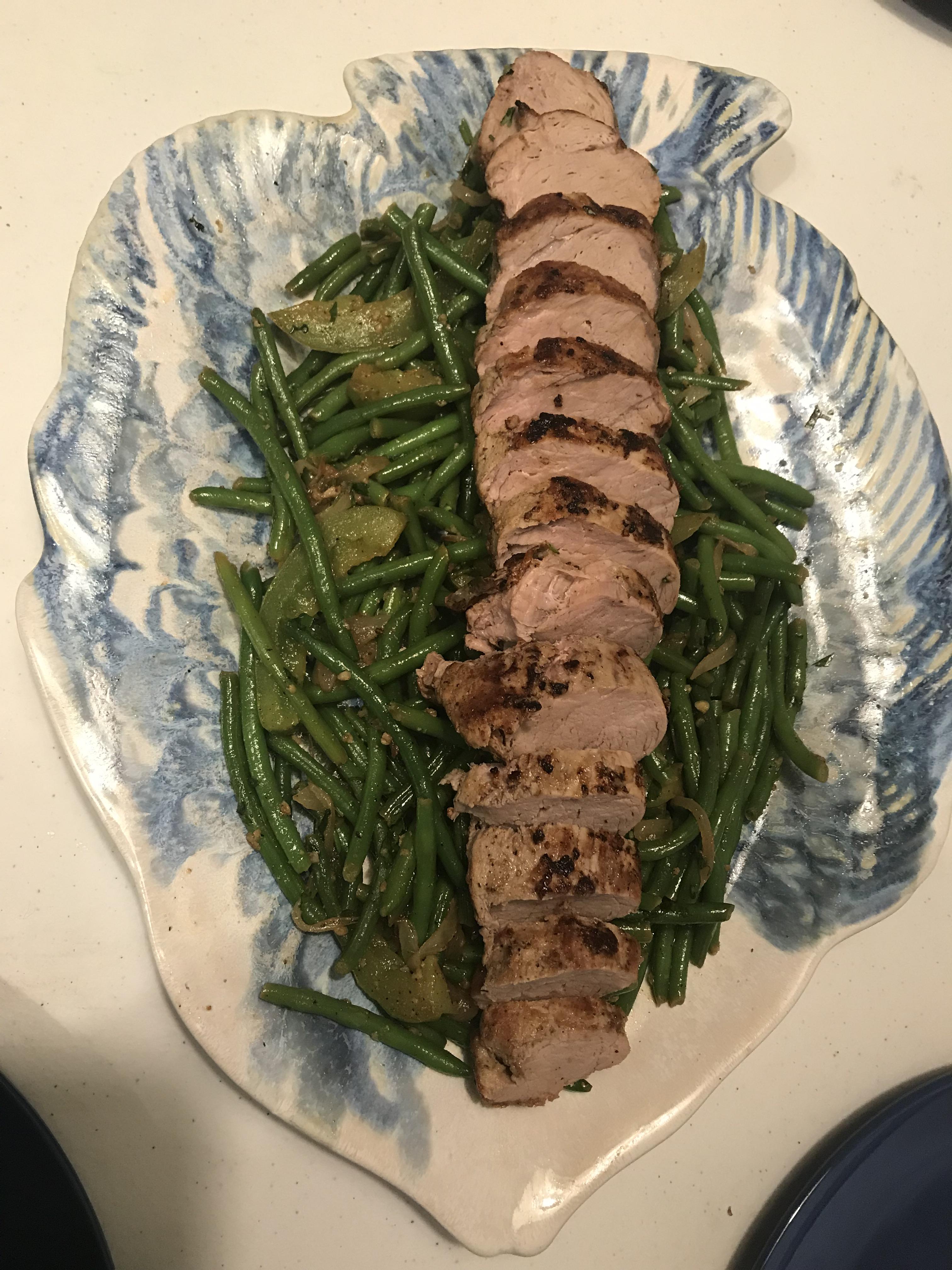 Pan seared oven roasted pork tenderloin on a bed of Mexican flavored
