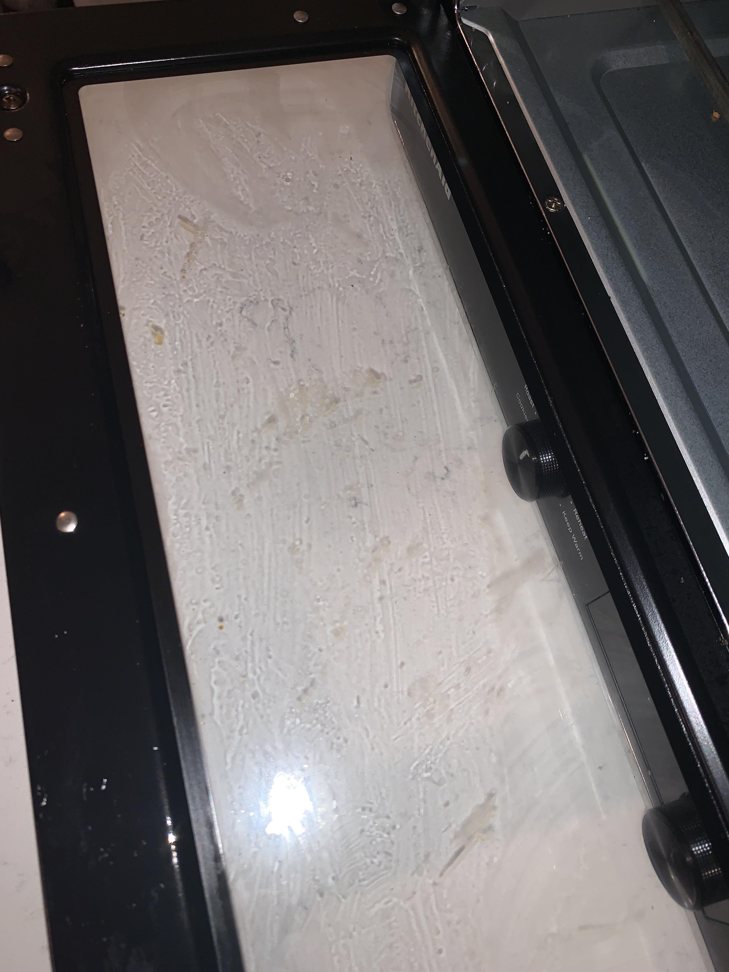 Cleaning toaster oven and can't get food gunk off. Lysol is not helping
