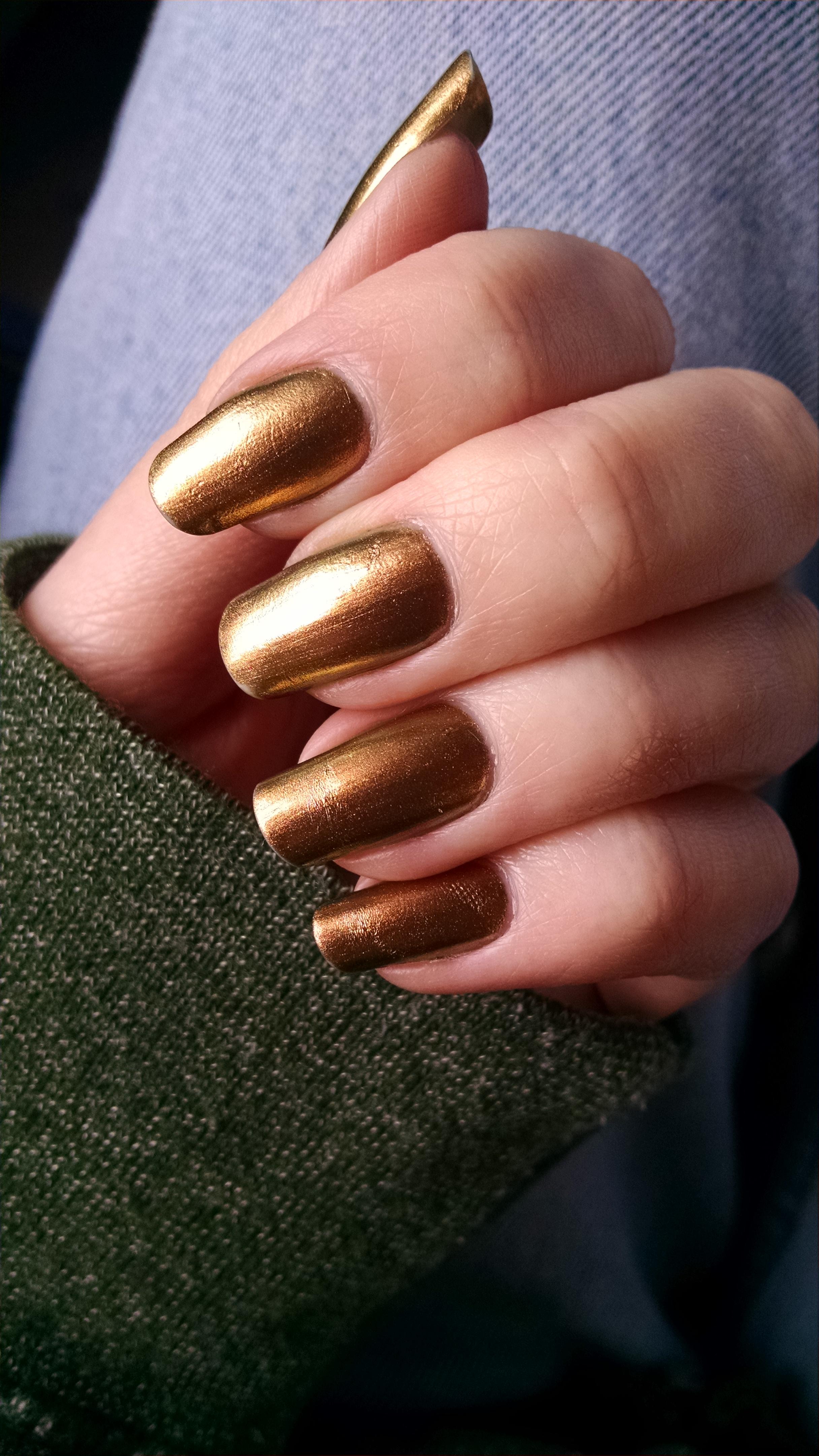 Sally Hansen's "Gilded", a beautiful gold multichrome which shifts to