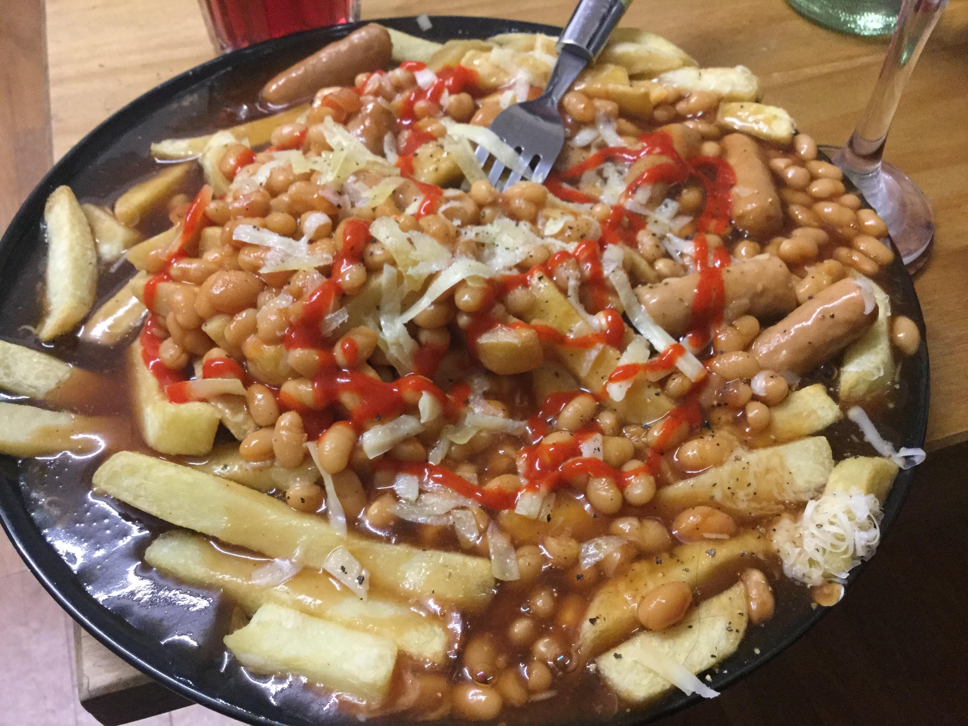 Gravy, beans & sausage from a can, chips cheese and sriracha r
