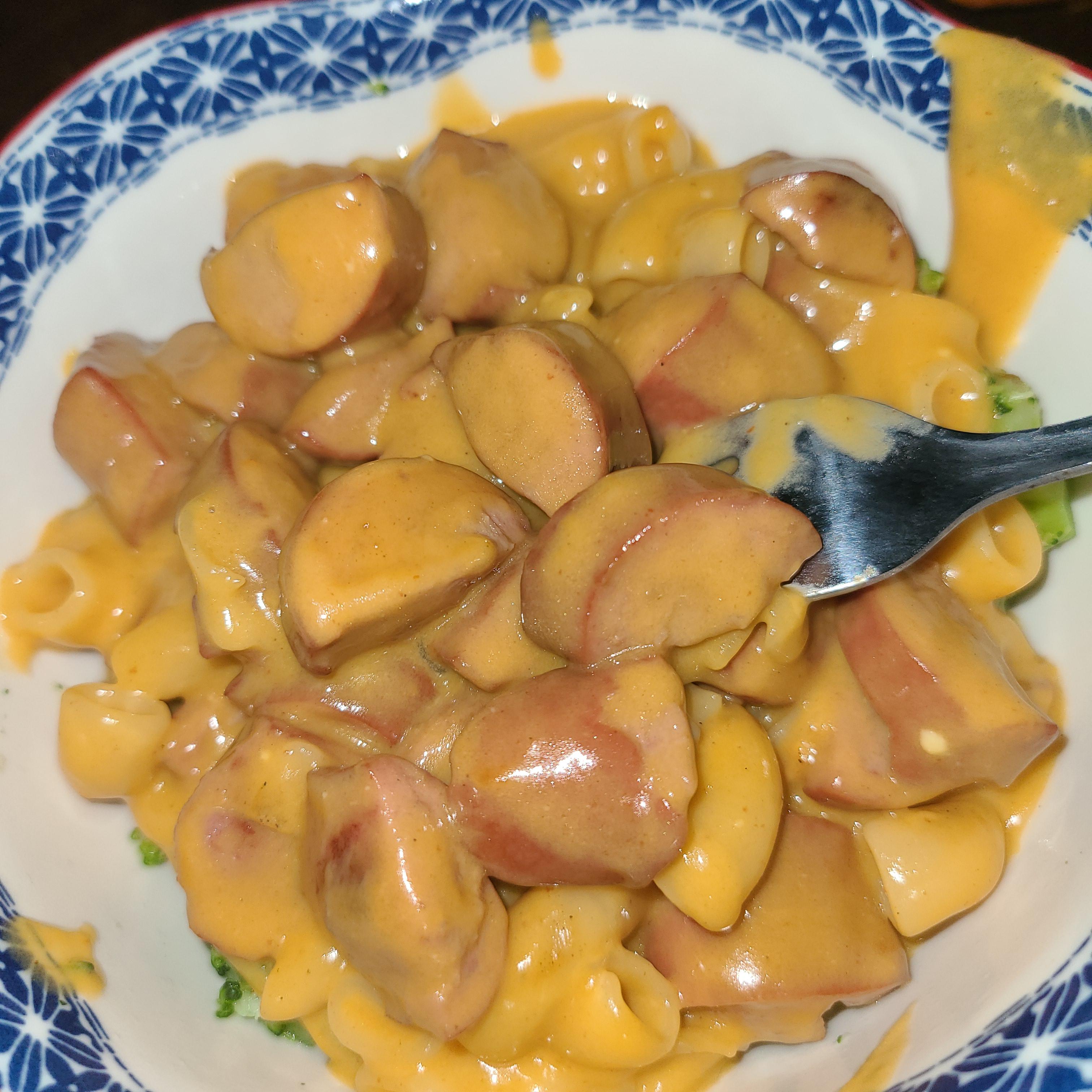 Hamburger helper made with hot dogs; over broccoli for balance r