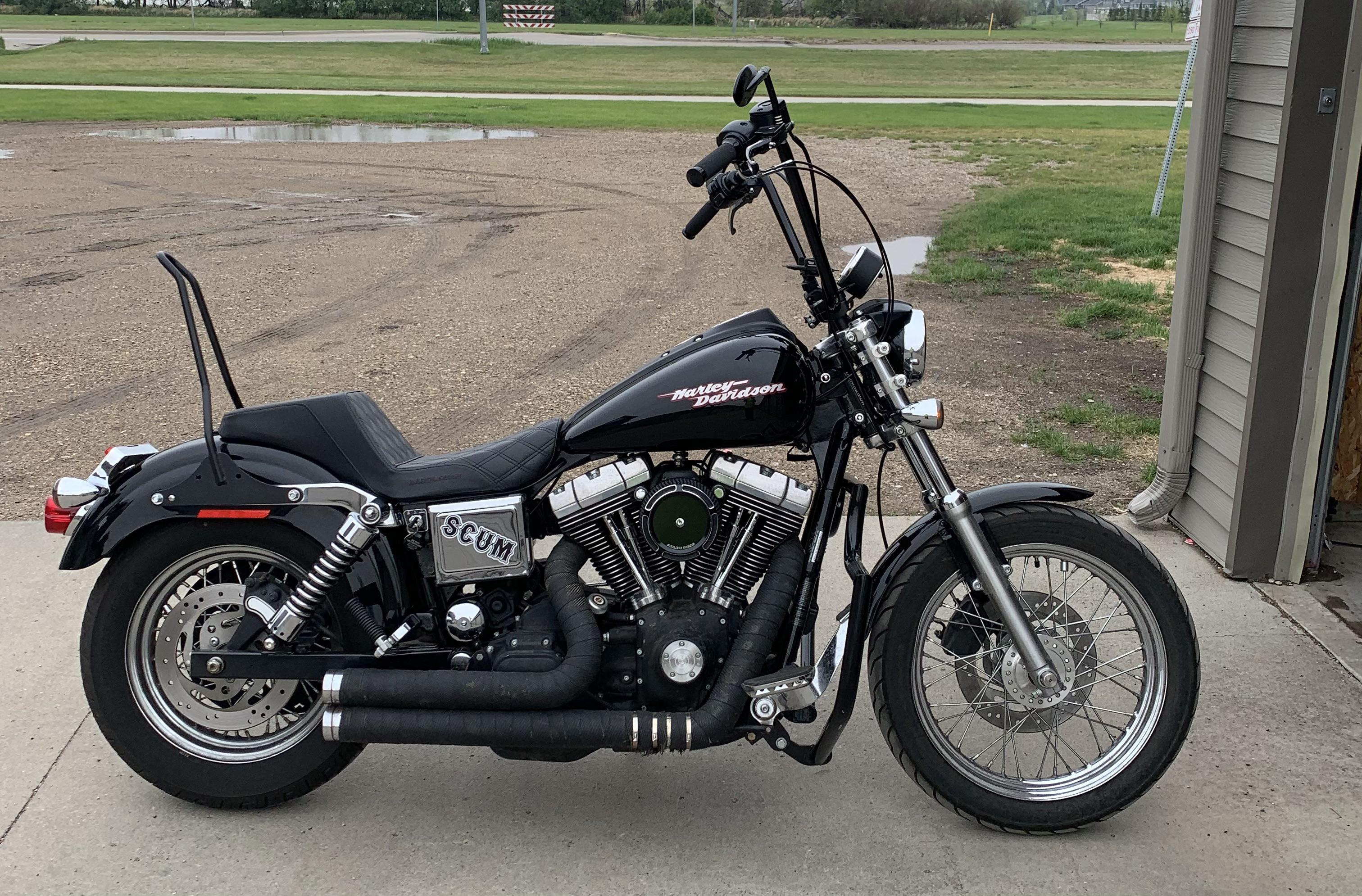 My 2004 FXD Super Glide with a 2” tank lift installed last weekend. r