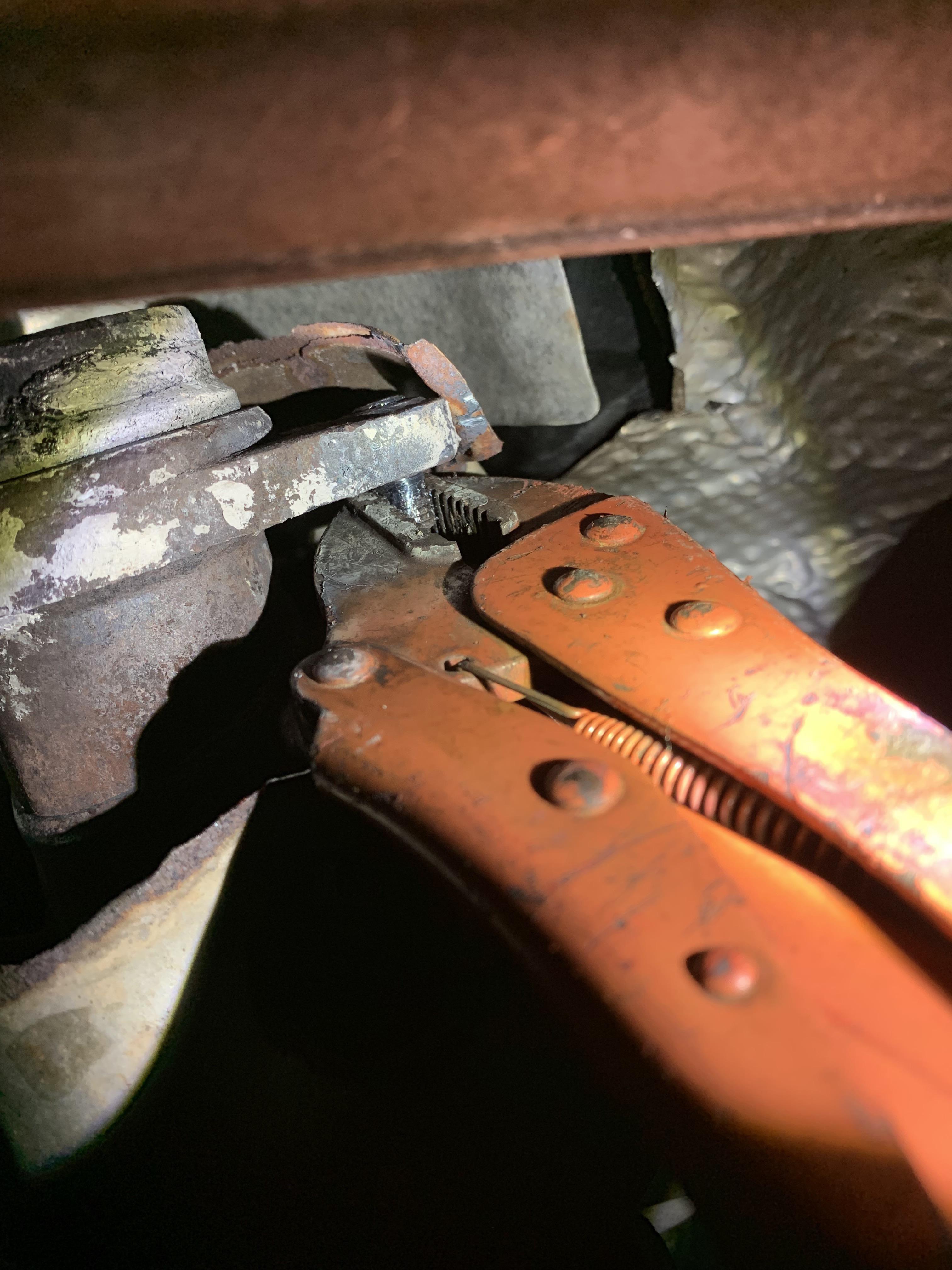 Working on a 2010 Nissan Sentra, Exhaust bolt snapped. It turns and