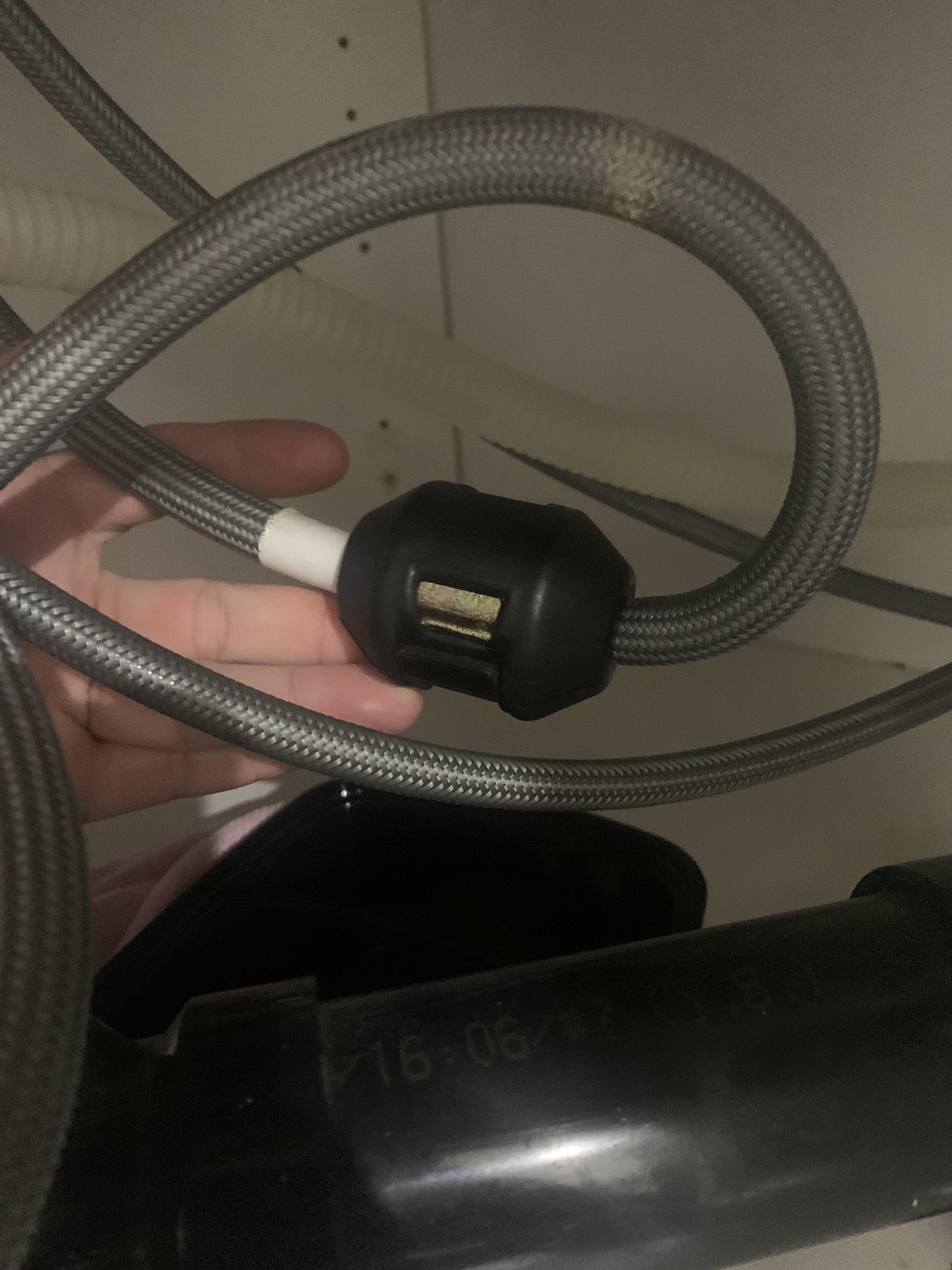 Leak from under the kitchen sink coming from this black piece. How to fix? It connects to the