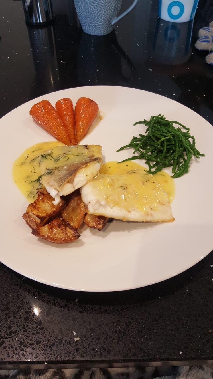 Sea bass fillets, beurre blanc, Vichy carrots and mini roasties