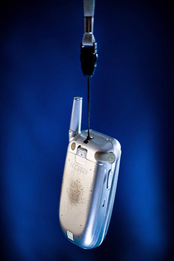 Putting cute "lanyards" on your "flip phones" to make it look cool. r