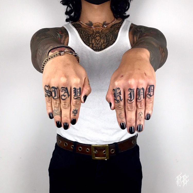 “Stay Kind” knuckle tattoos by Rebecca Blackletter Misery Tattoo Salt
