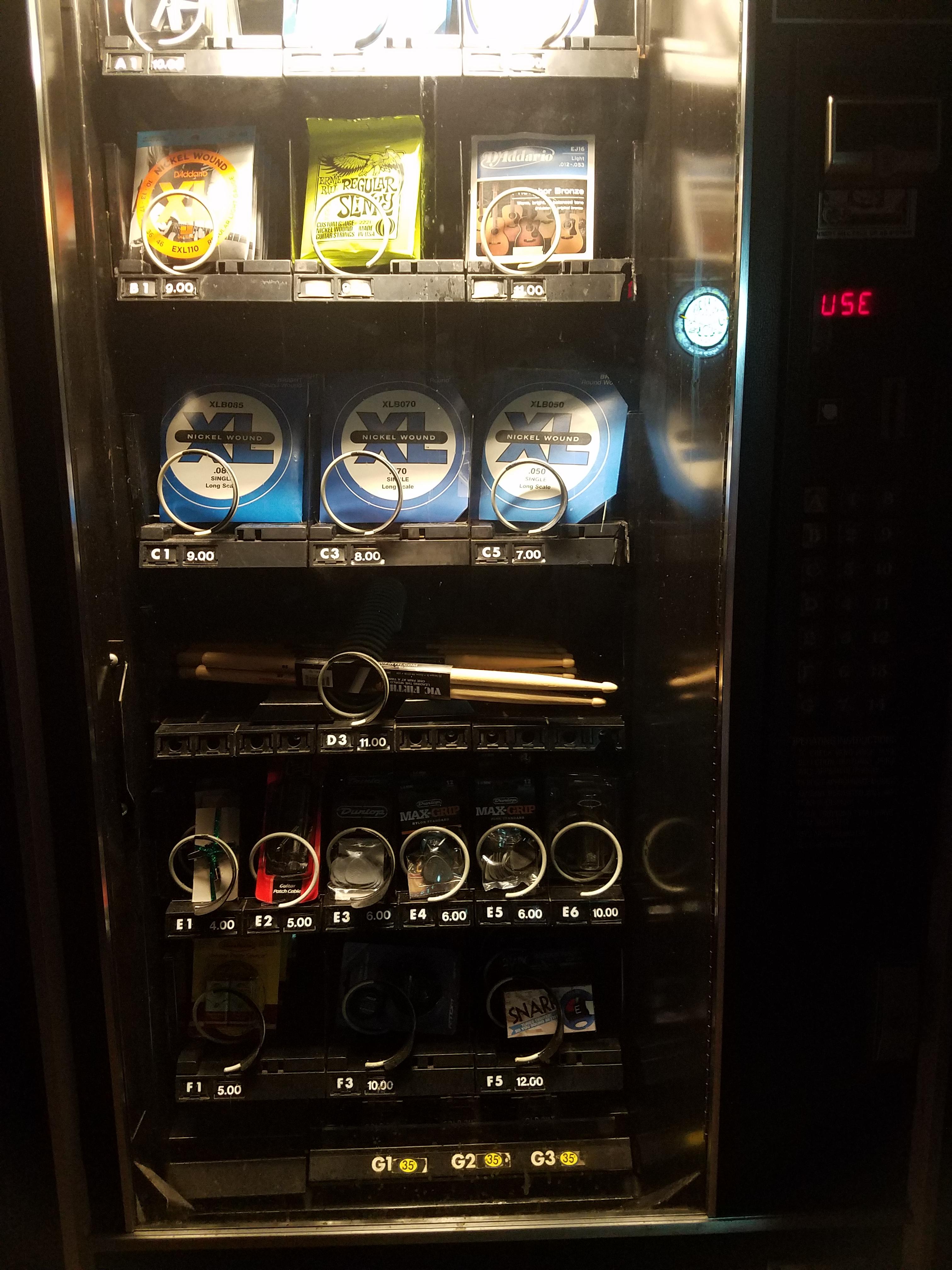 This bar/venue has a vending machine that sells sticks, moon gel, drum