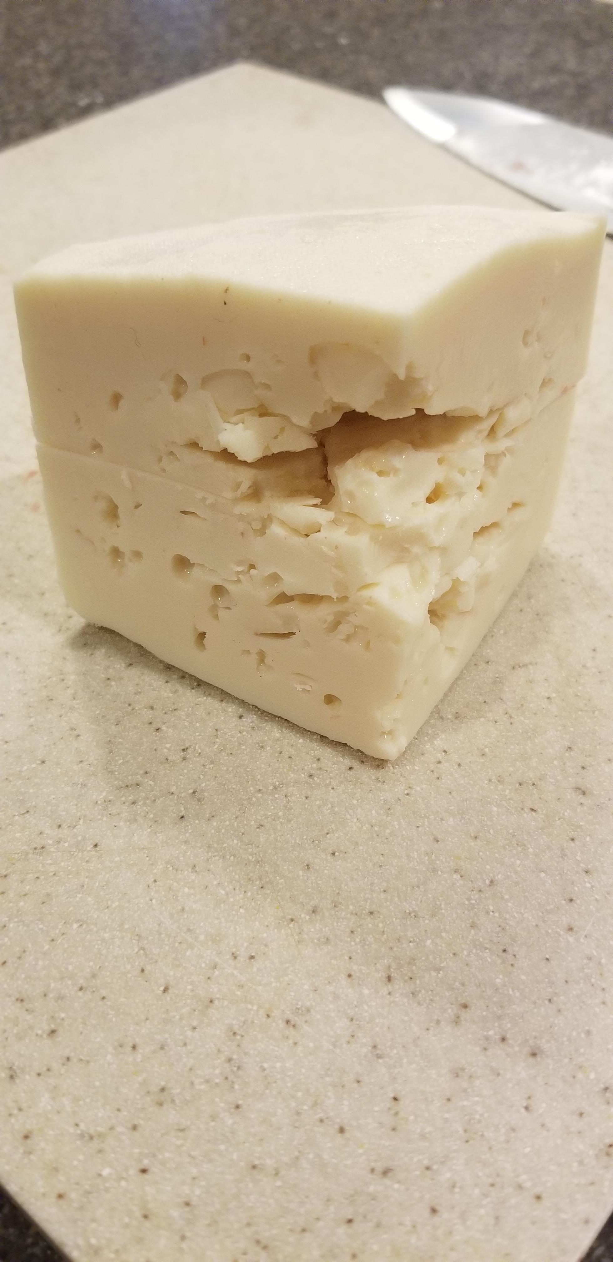 Second time making gouda doesn't look good but tastes great! Any ideas