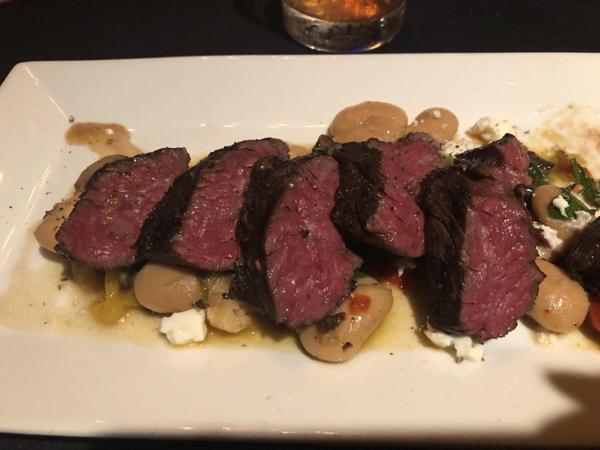 Green Egg smoked hanger steak cooked sous vide over fava beans, ages