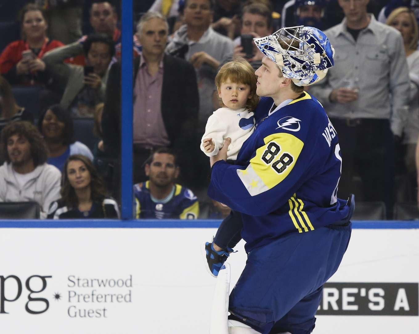 Tampa Bay Lightning goalie Andrei Vasilevskiy (88) skates with his son