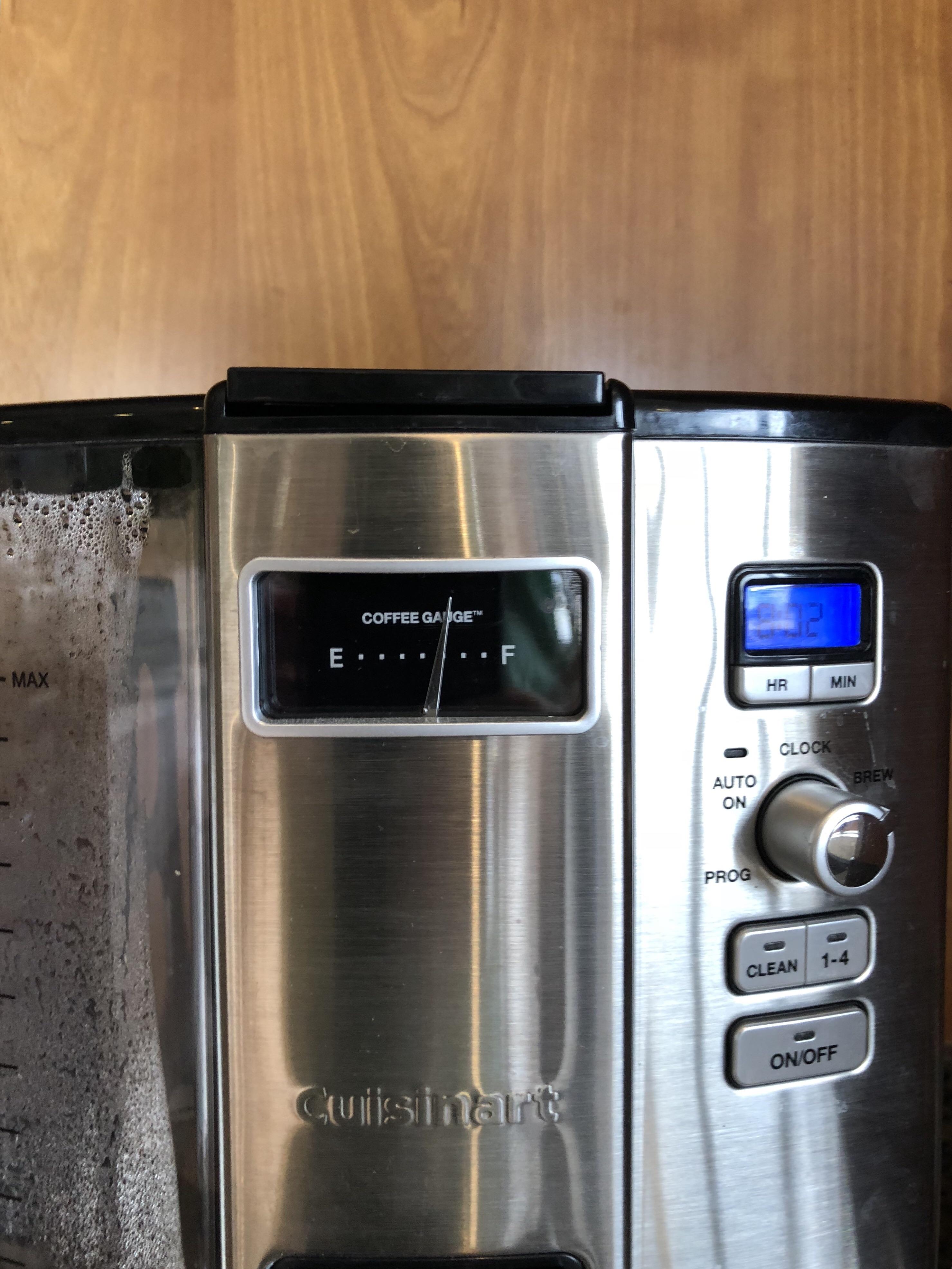 Coffee machine at a car dealership has a gauge that shows empty to full