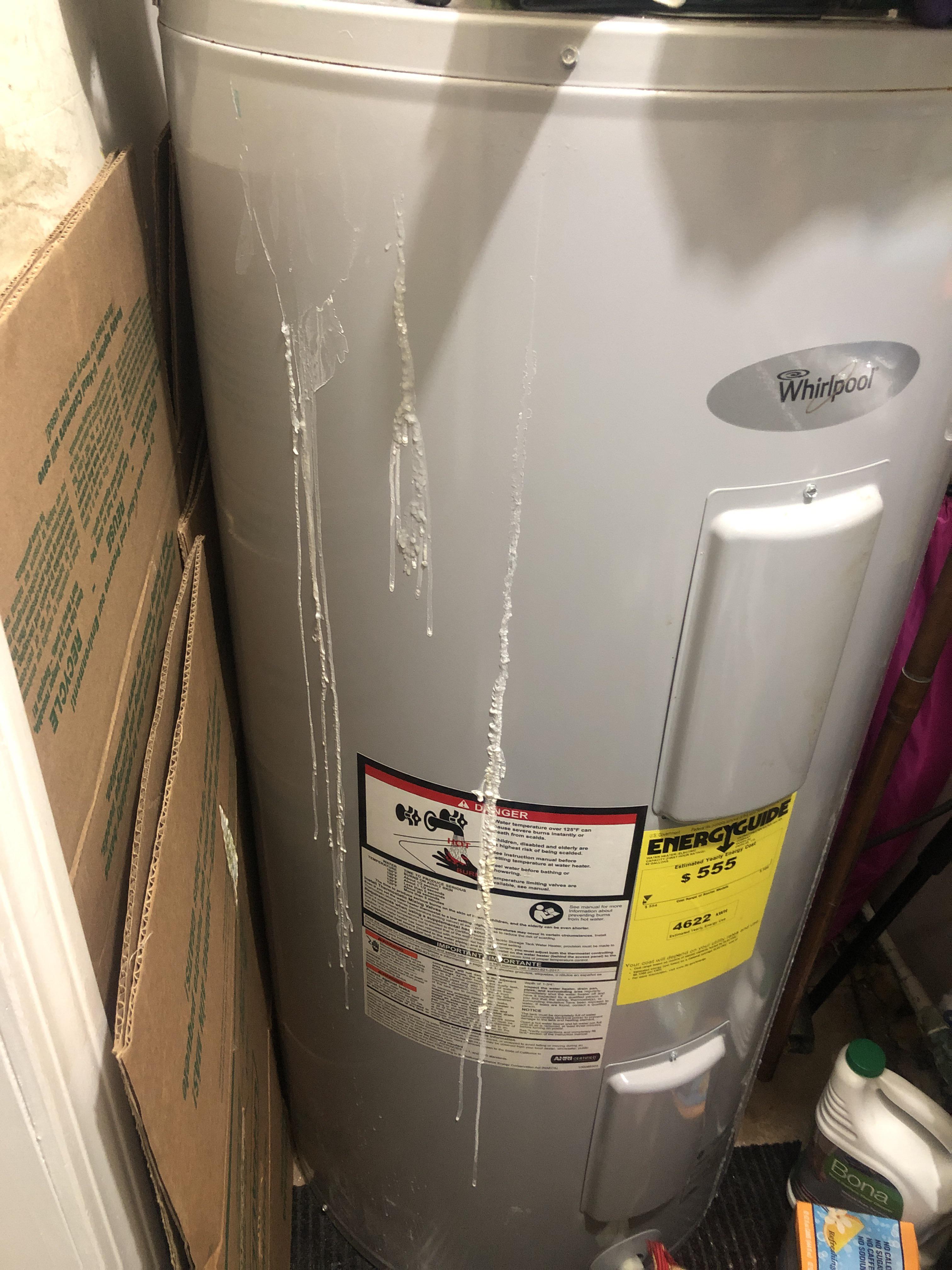 Water heater leaking this white hard stuff. Smells like chlorine. r