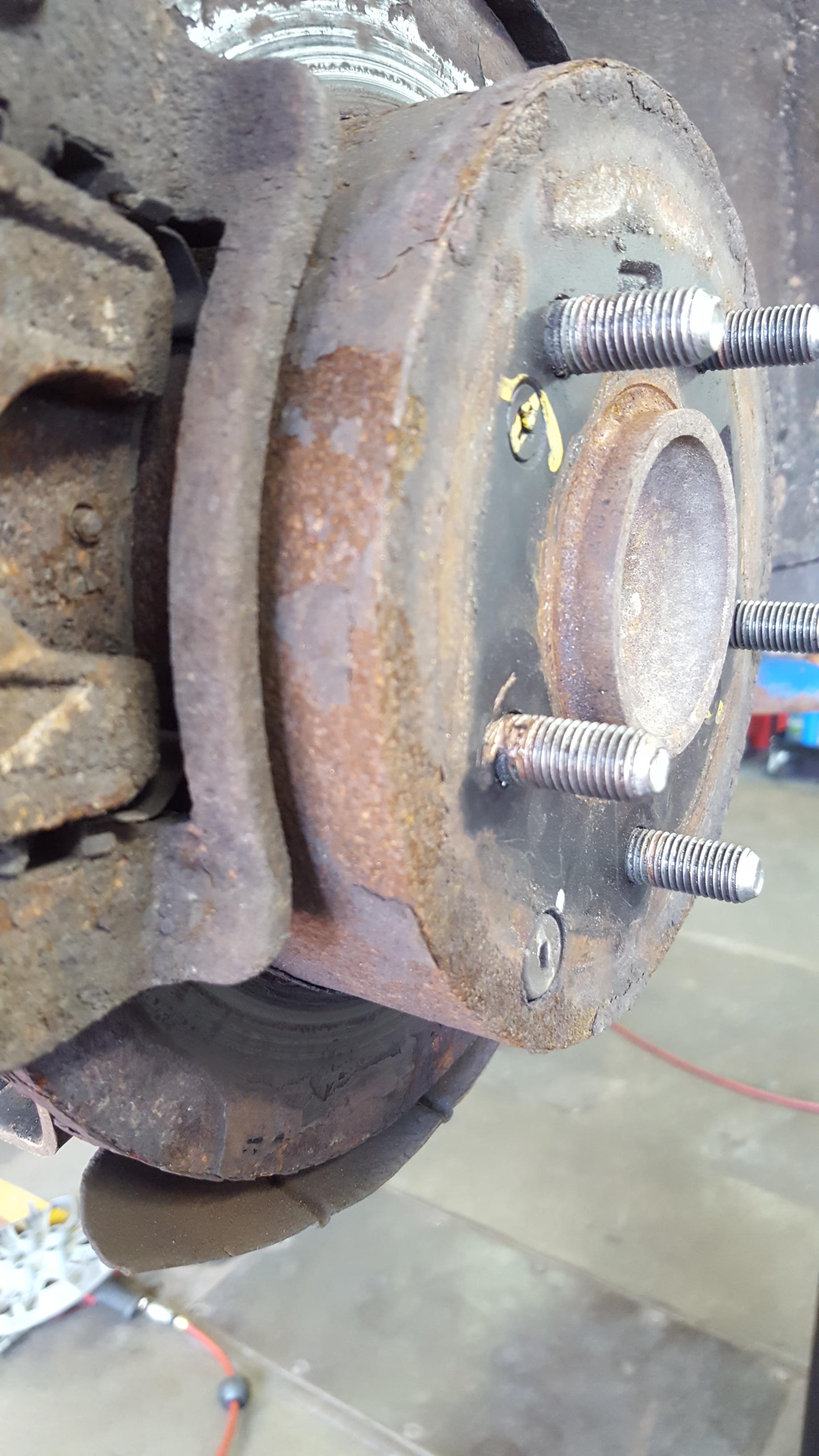 Nevermind the seized caliper slide, check out the copper antiseize and