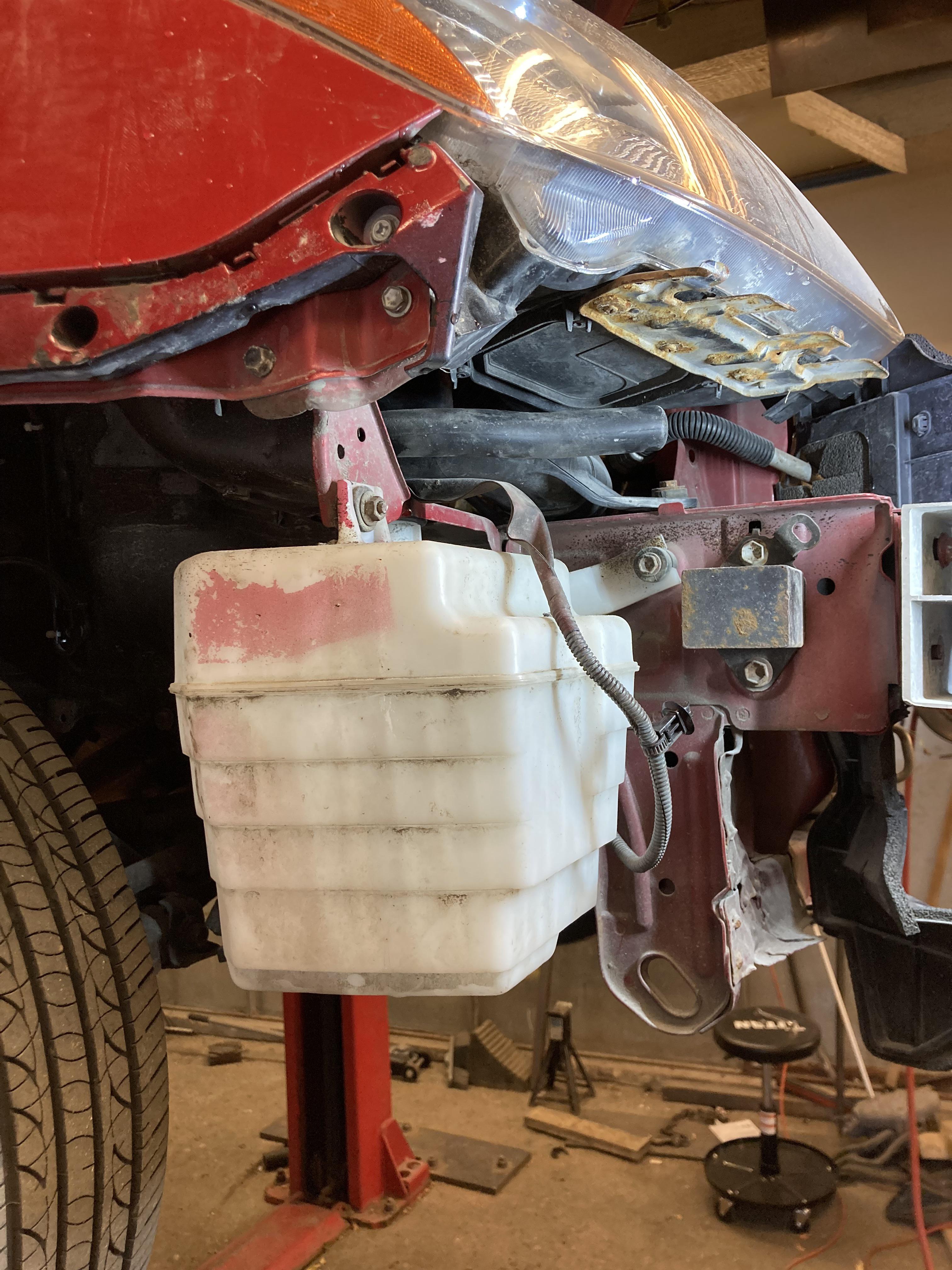 2008 Prius: I have a reservoir on the RH side under the washer fluid